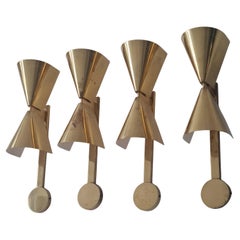 Set di quattro focaccine su commissione di Paavo Tynell in ottone traforato, Taito, anni '50
