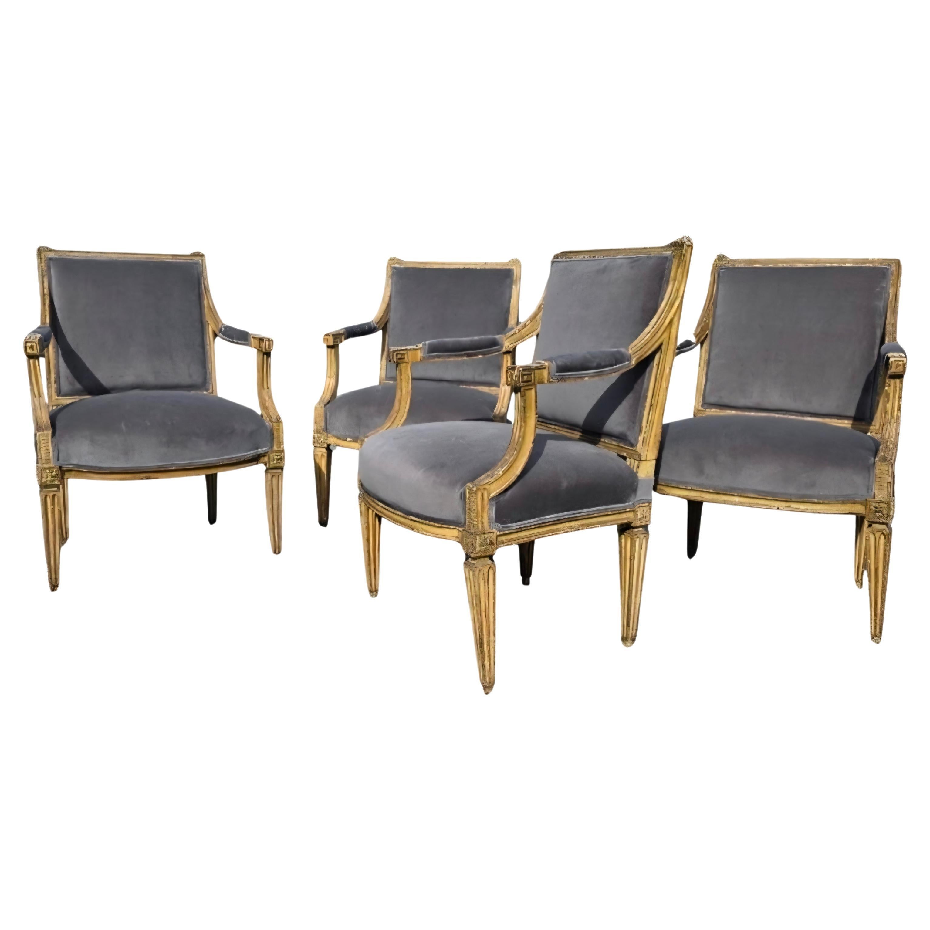 A very handsome, stately set of four, 18th century, neoclassical arm chairs. Great cream painted surface with maroon accenting. These chairs reek of the passing of time. All the Upholstery and the insides have been retied and replaced. 
There are
