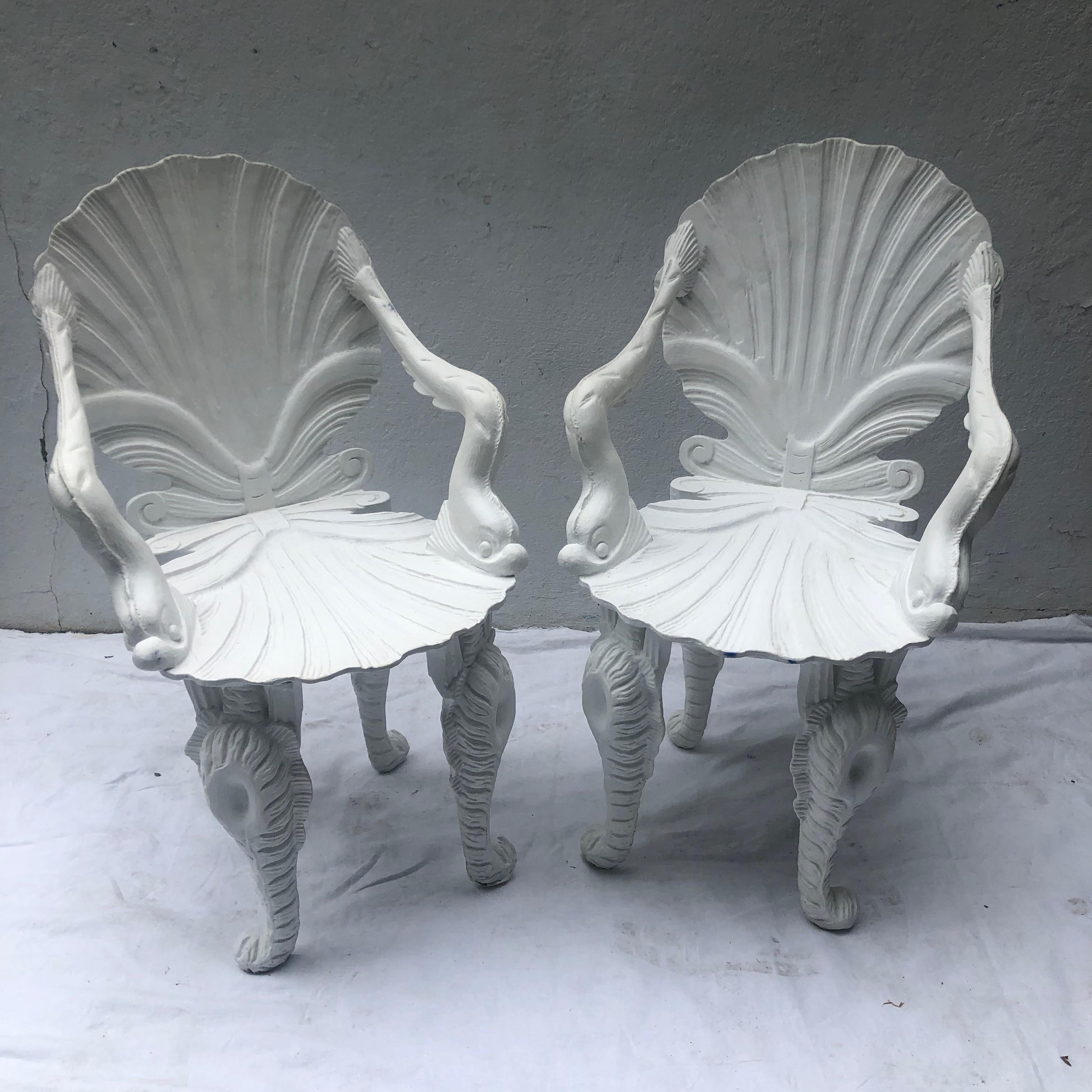 Pair of four painted white carved wood Grotto armchairs.