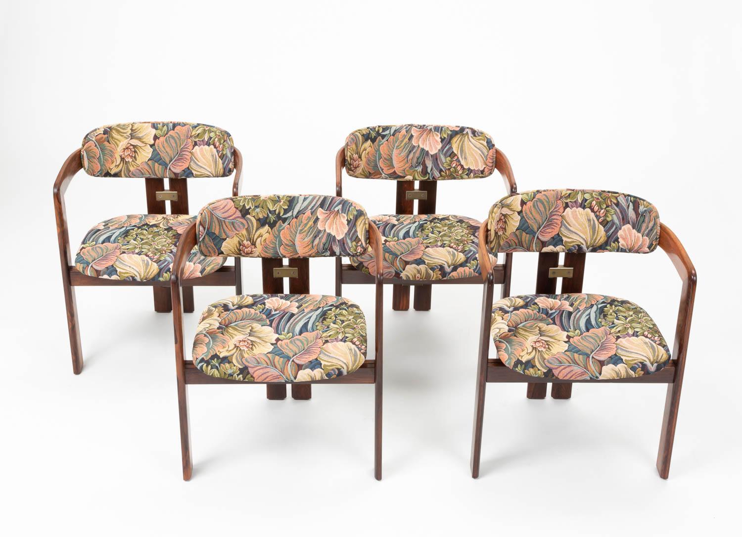 Set of four Augusto Savini 'Pamplona' rosewood dining room chairs. The 1965 design was produced by the Italian brand Pozzi. The chairs are upholstered in a playful floral/plant leaf fabric and aluminum elements accent the minimalist frame. This