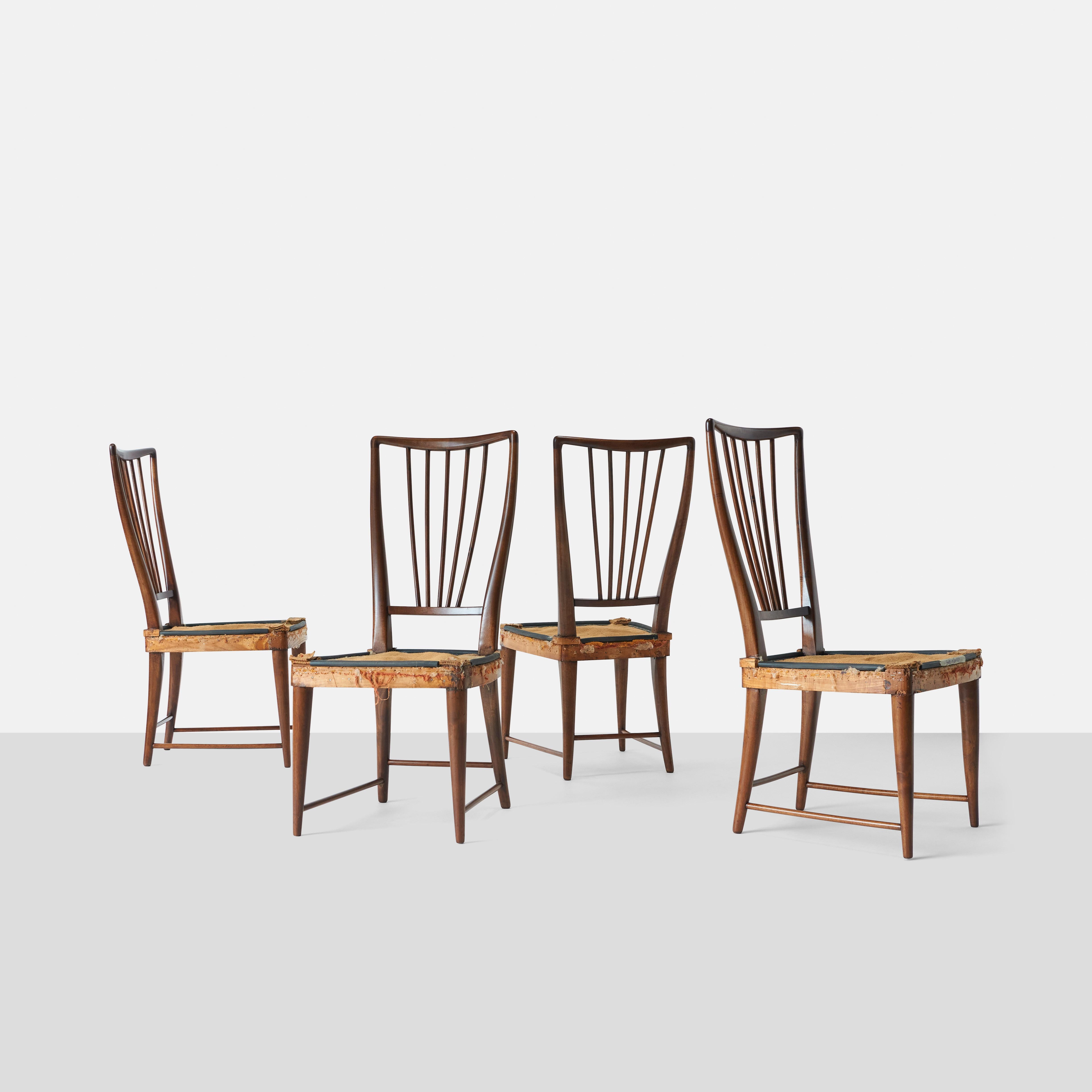 Set of four Paolo Buffa walnut dining chairs. The frames are fully restored. Price includes upholstery of seats in COM.
      