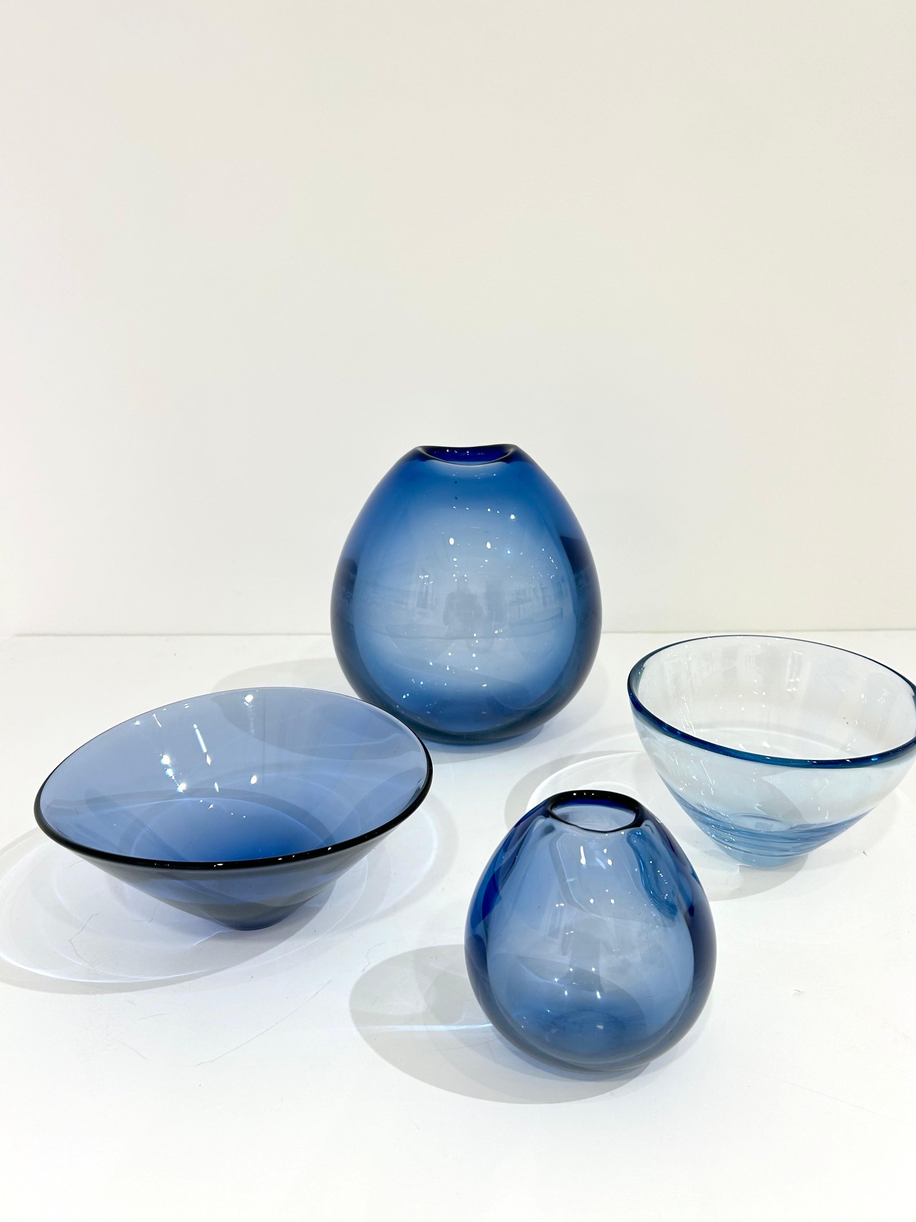 Set of 4 hand-blown glass pieces by Per Lutken for Holmegaard. Consists of two vases and two bowls. Denmark, circa 1960s.
Dimensions:
Large Vase: 9.5