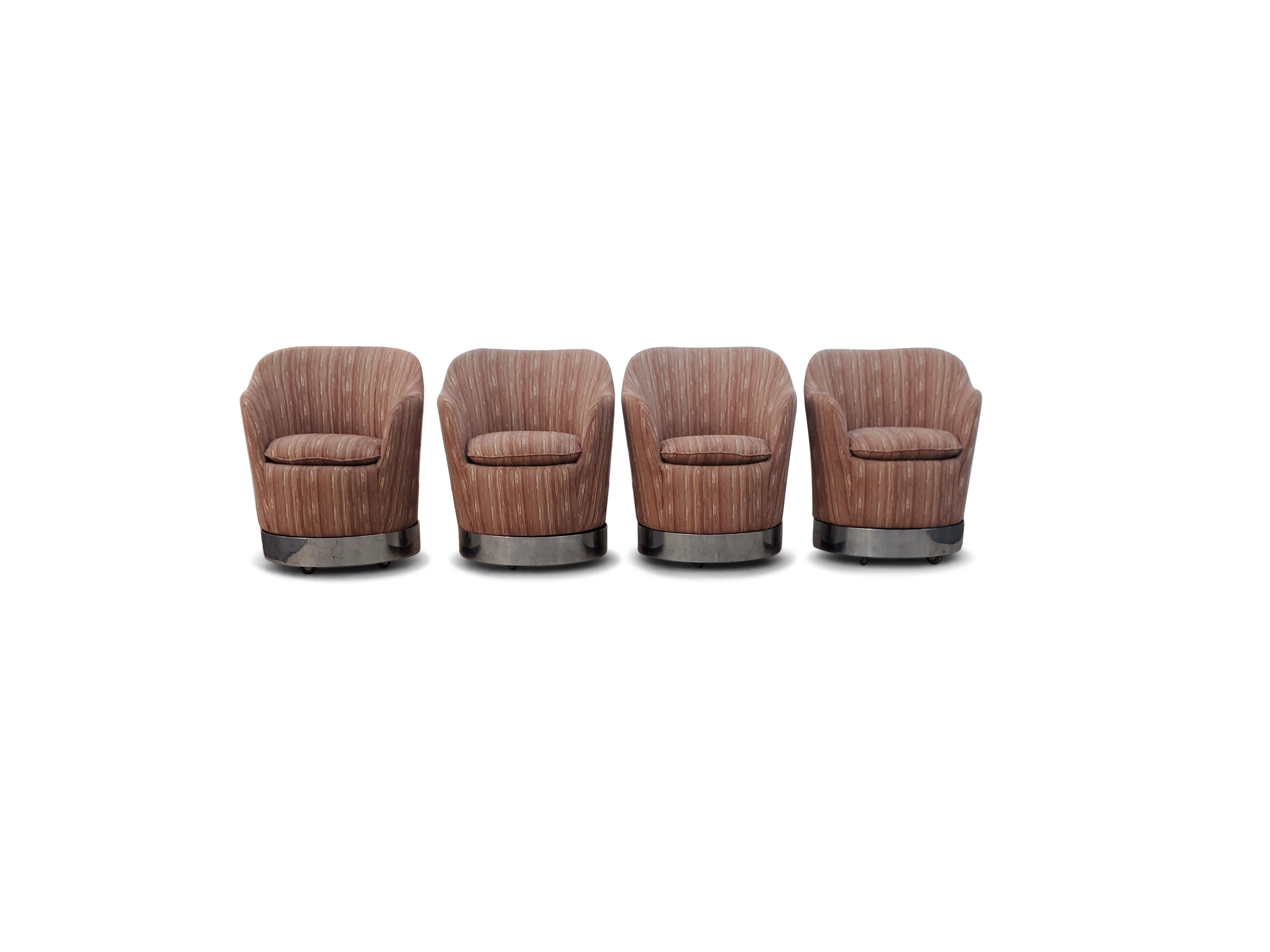 Set of four Philip Enfield swivel chairs 

Chairs swivel, rock, and roll smooth on castors. Chairs are signed.
