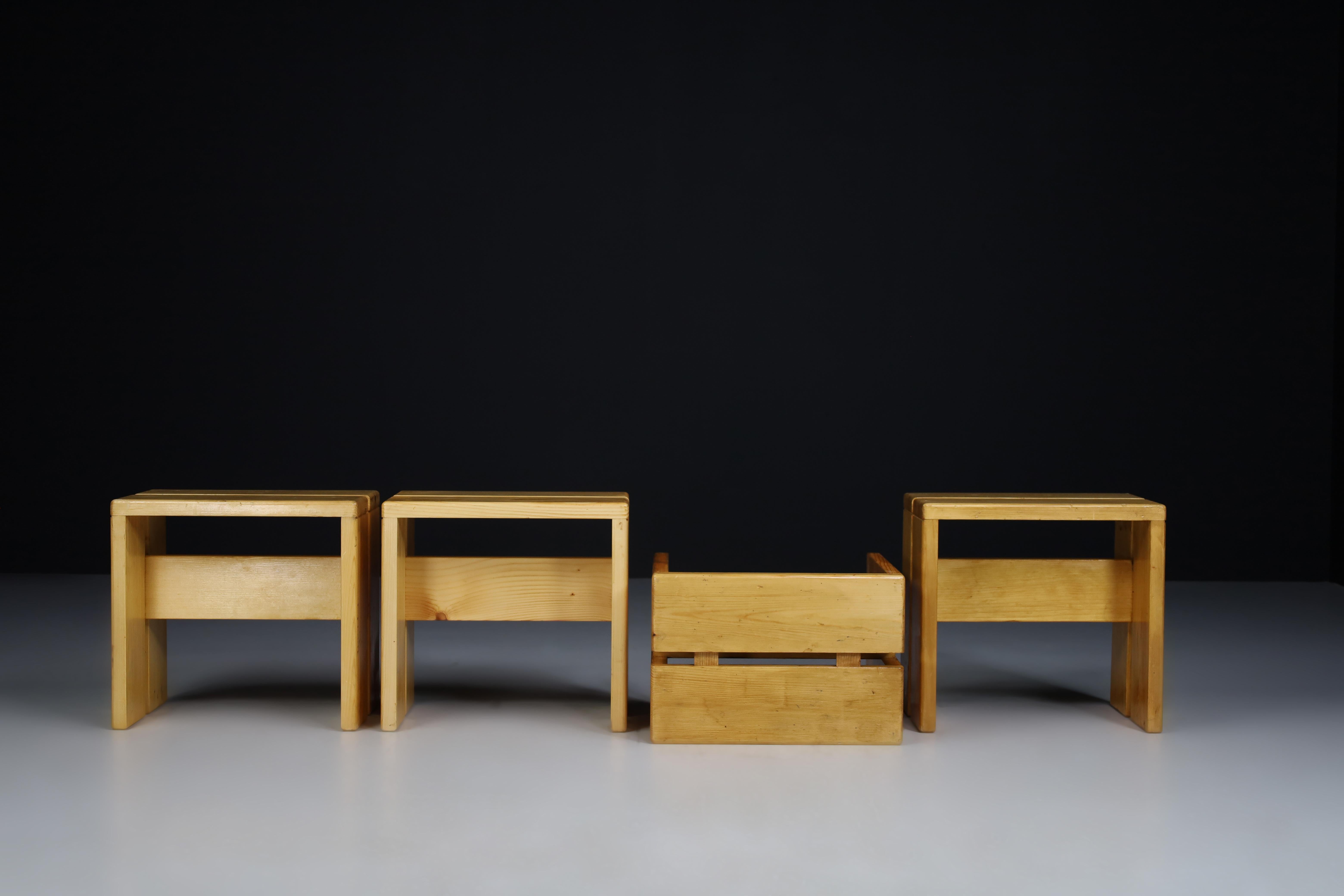 Charlotte Perriand pair of four stools in pine wood for Les Arcs ski resort, circa 1960 manufactured in France. These are the iconic Charlotte Perriand simple and straightforward pine stools used commonly throughout the ski resort. The four stools
