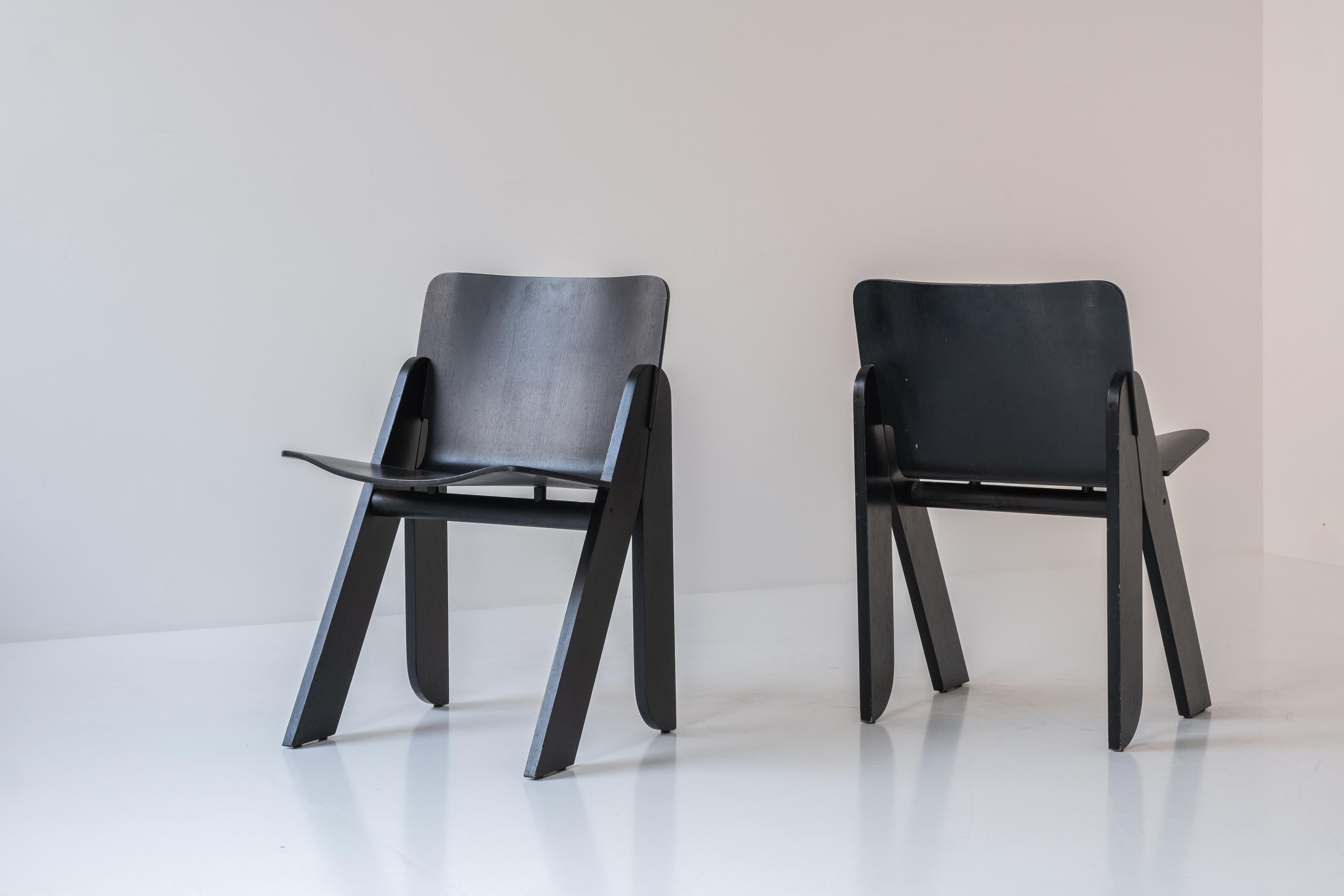 Set of four ‘Poeta’ dining chairs by Gigi Sabadin for Stilwood, Italy, 1970s. This chair is made out of moulded ash plywood and are all in a very well presented and original condition. Admire this rare black stained version which is very uncommon