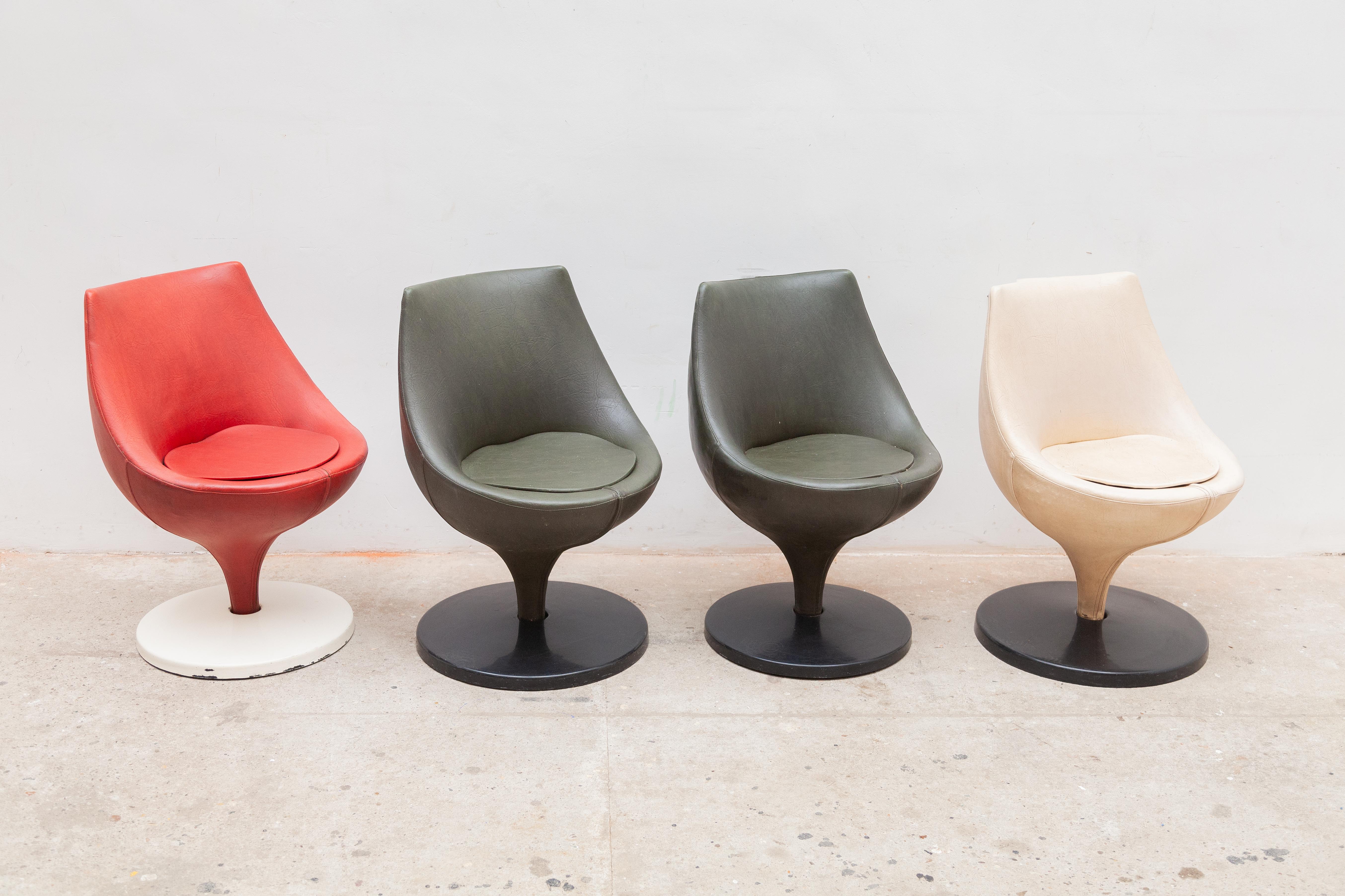 Set of four Polaris swivel dining chairs designed in 1965 by french designer Pierre Guariche for Meurop,Belgium. Featured in the colors ivory white,red and olive green skai, metal swivel base covered with black plastic disc. All four are in their