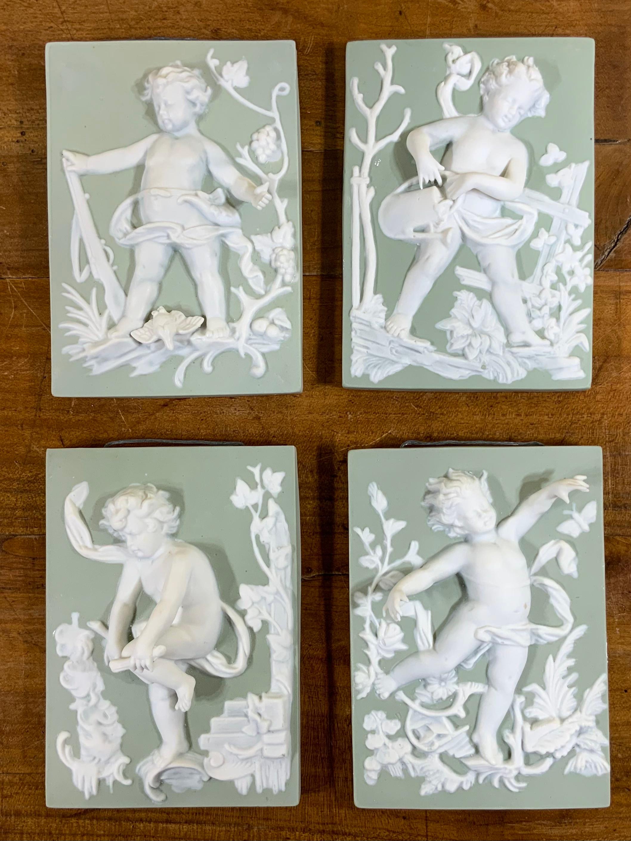 Set of Four Porcelain-Bisque Cherubs Statues 4