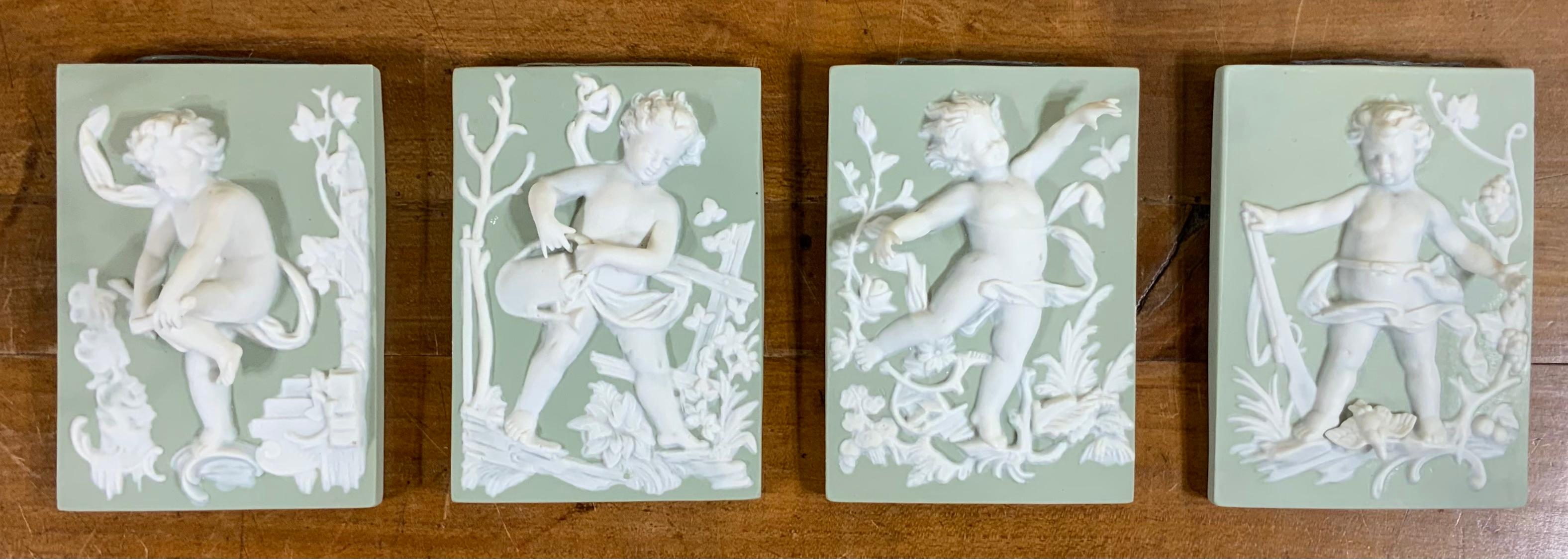 Mid-20th Century Set of Four Porcelain-Bisque Cherubs Statues
