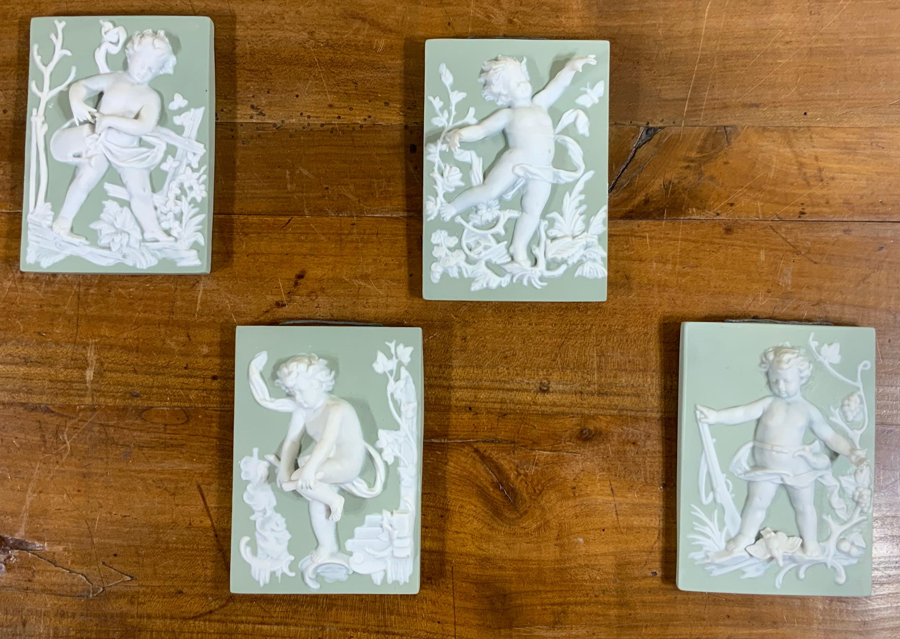 Set of Four Porcelain-Bisque Cherubs Statues 1