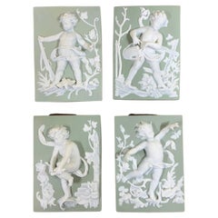 Vintage Set of Four Porcelain-Bisque Cherubs Statues