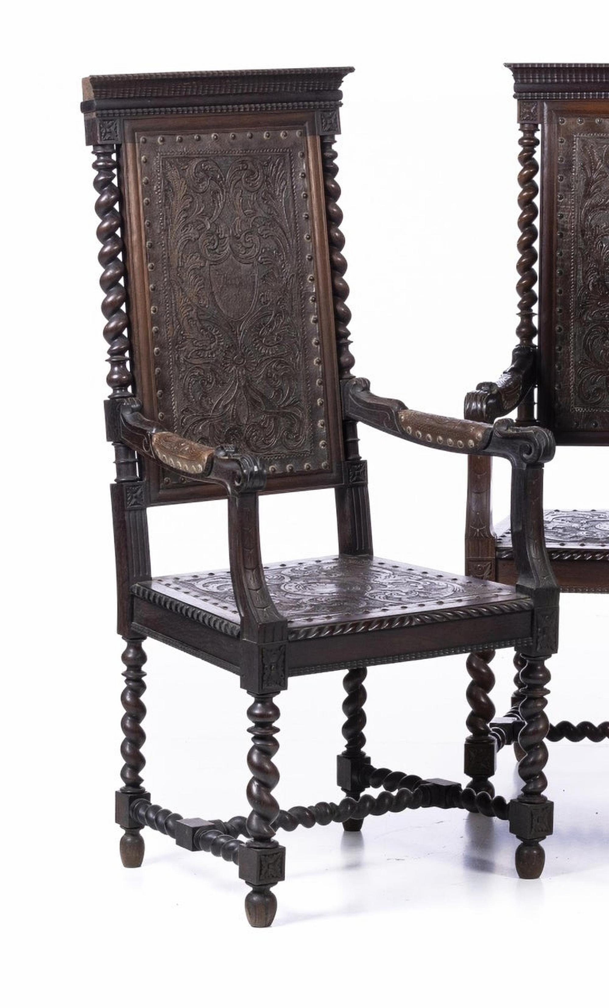 Set of four armchairs

Portuguese from the 18th Century,
in chestnut and Brazilian rosewood wood with carvings. 
Scalloped backrest and carved leather seat, roll-up arms, turned legs. 
Dim.: 125 x 51 x 52 xm.
very good condition.