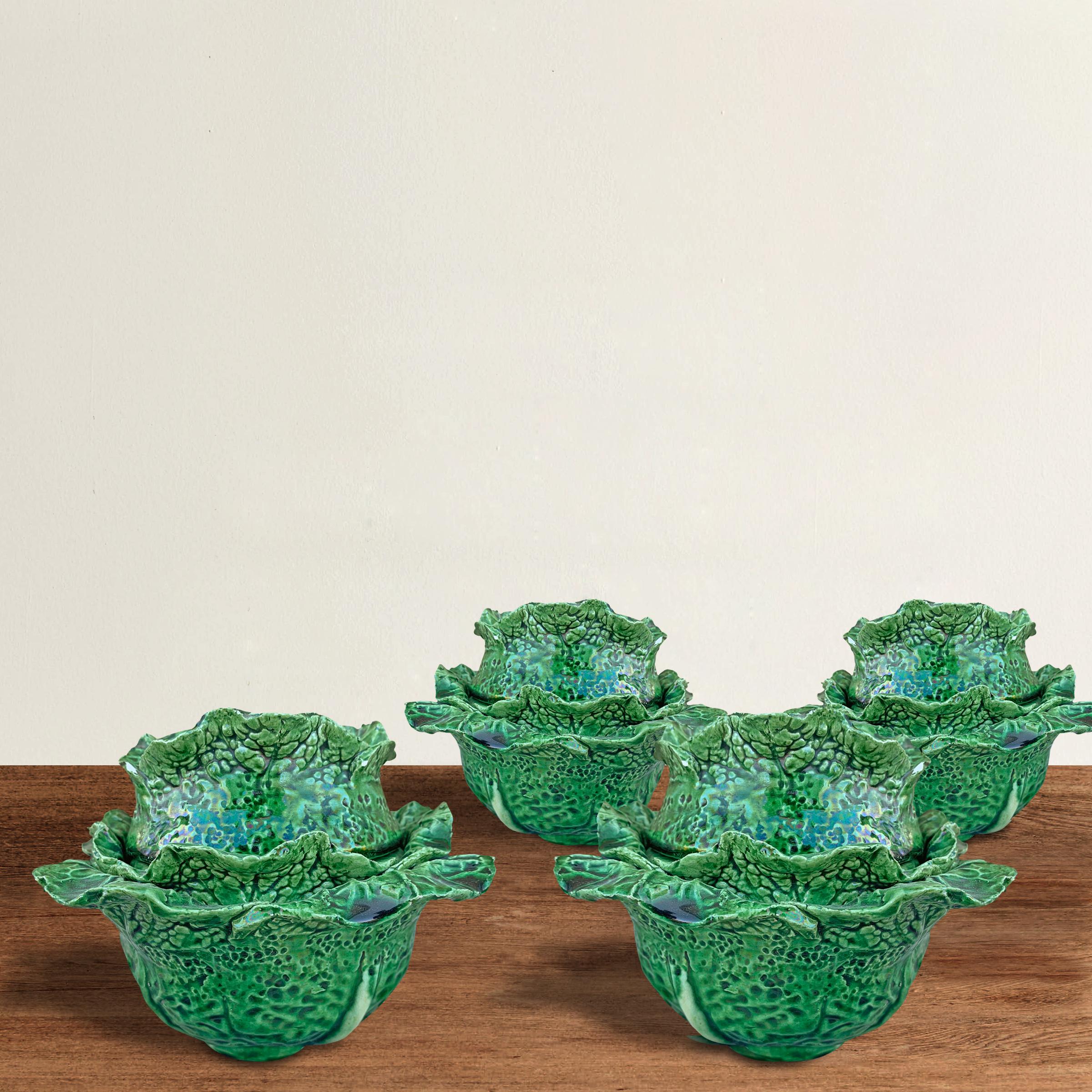 A fantastic and whimsical set of four early 20th century Portuguese hand-built ceramic covered cabbage bowls in the style of Dodie Thayer. Perfect for display on a shelf or table, but also fully functional for nuts and candies at your next cocktail