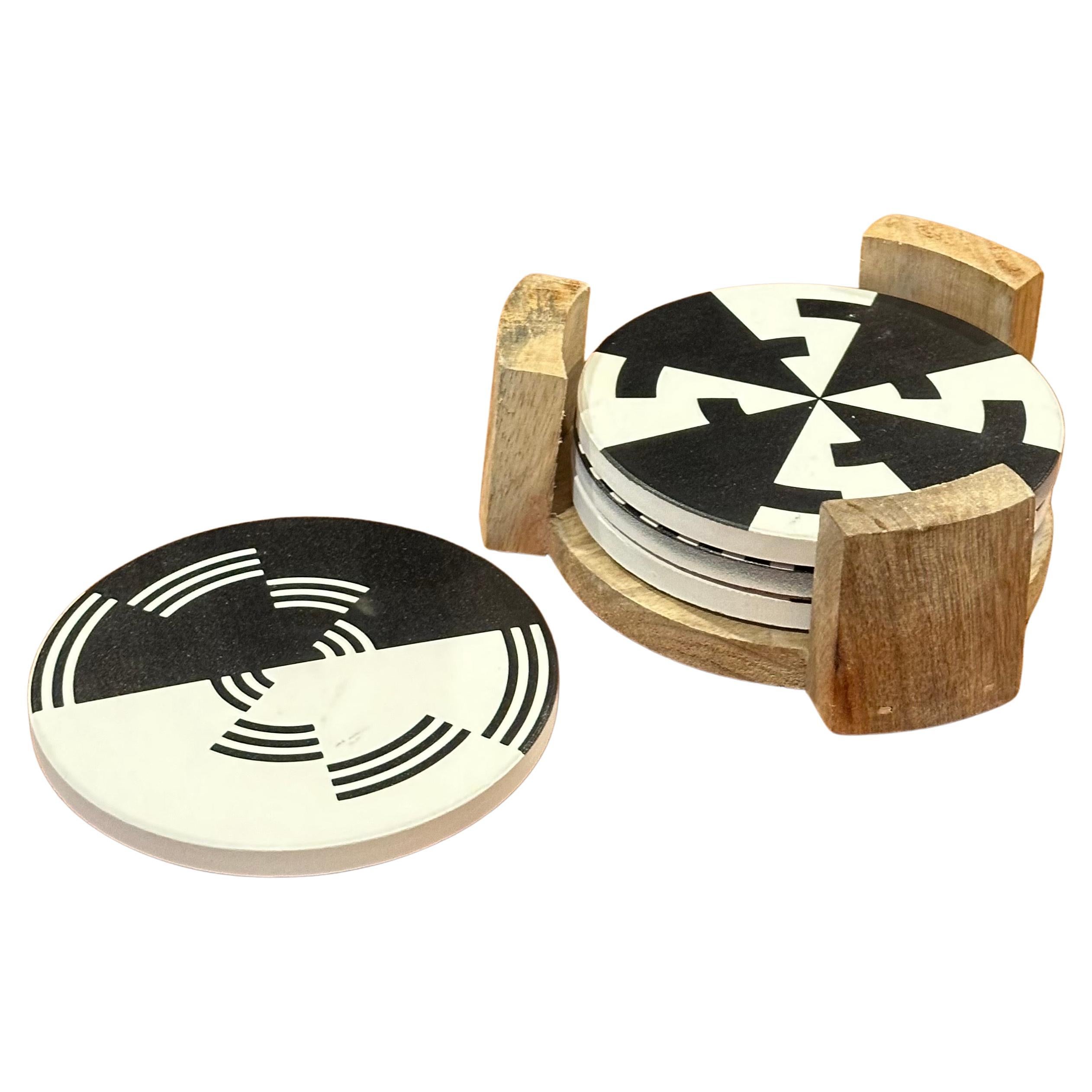 A nice set of four post-modern coasters with holder, circa 1990s. The coasters have a cork lining and are in very good vintage condition; the set measures 5