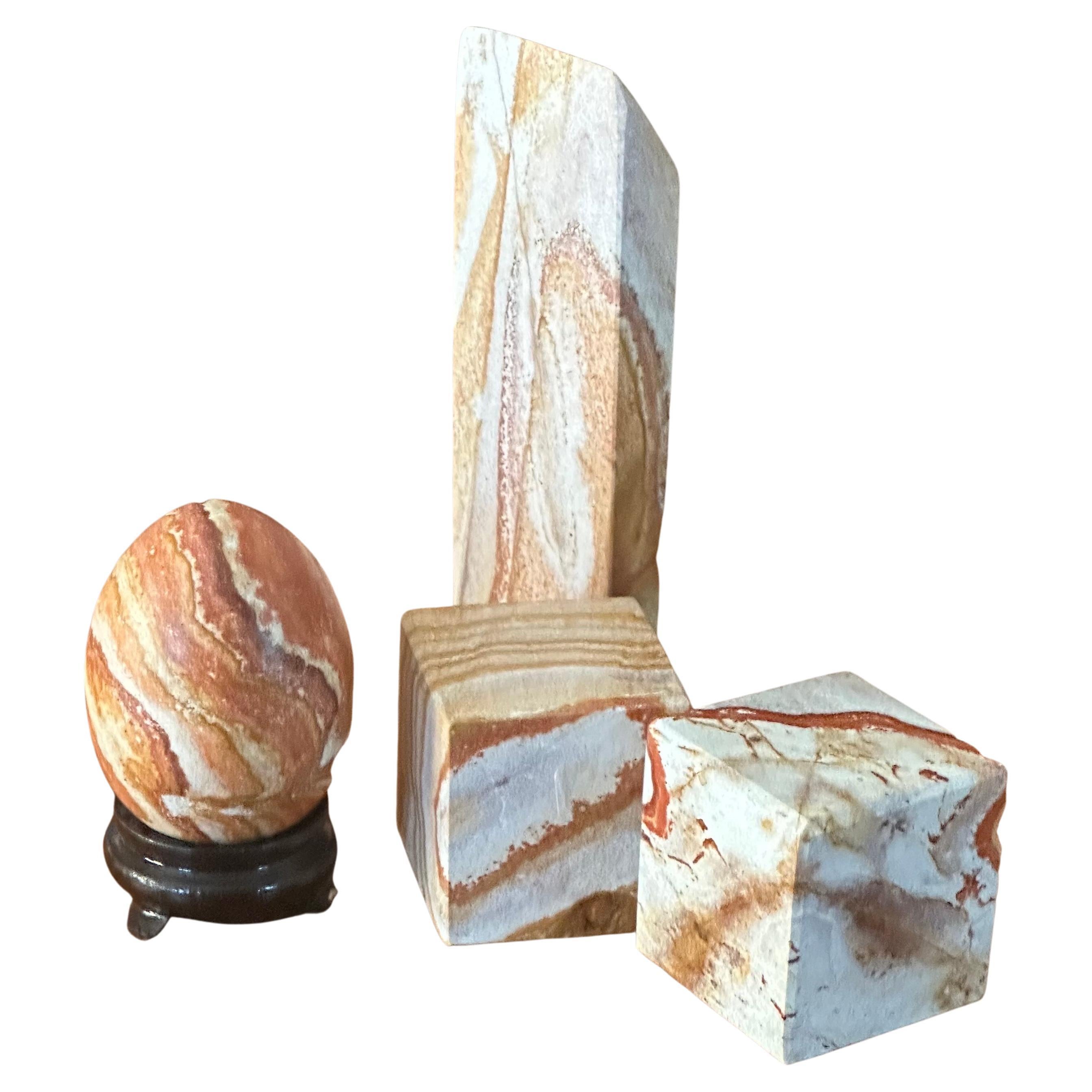Gorgeous set of four post-modern marble blocks / paperweights, circa 1980s. The pieces are in very good condition with no chips or cracks and the largest one measures  3