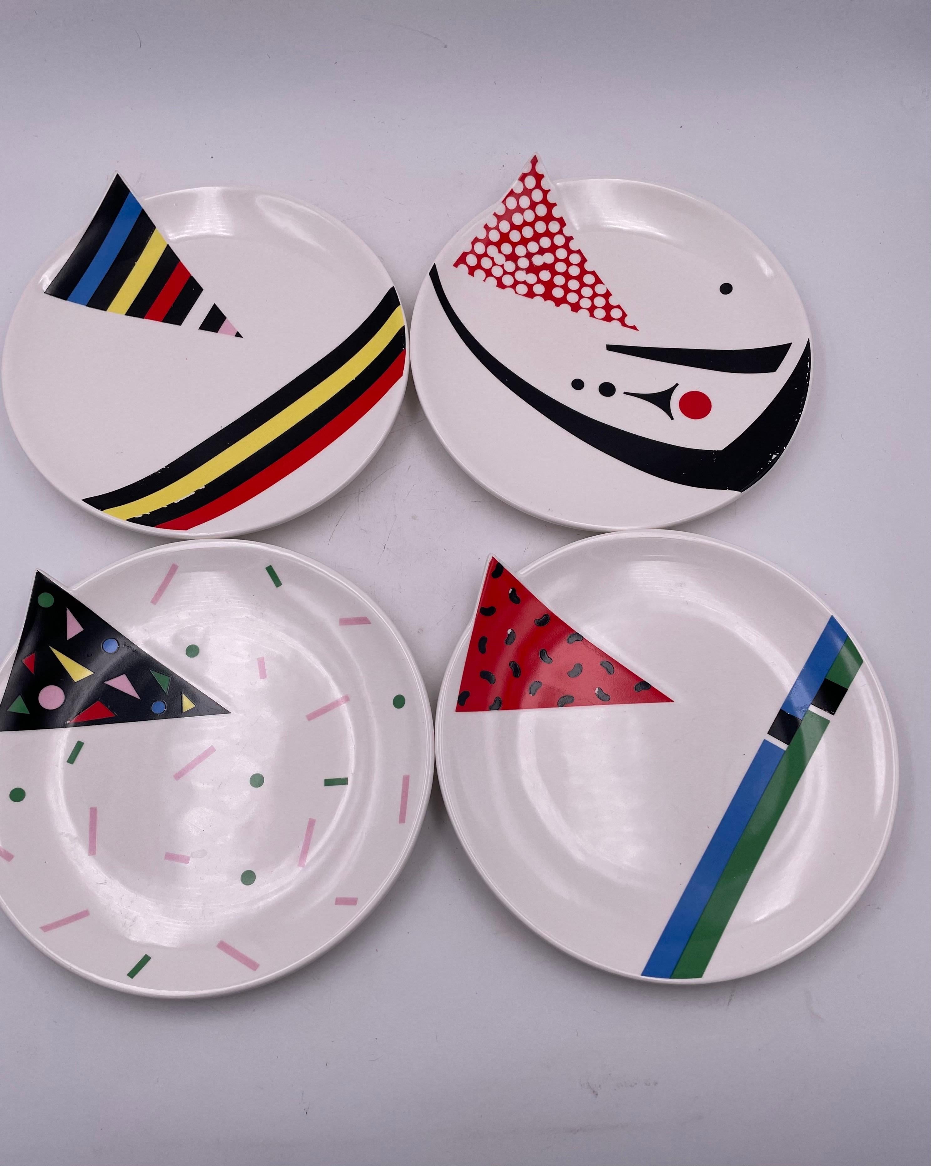 Set of four post-modern / Memphis plates by Kato Kogei for Fujimori, circa the 1980s. Alpha 3 collection Wonderful colorful Memphis style some wear due to age and use no chips or cracks.