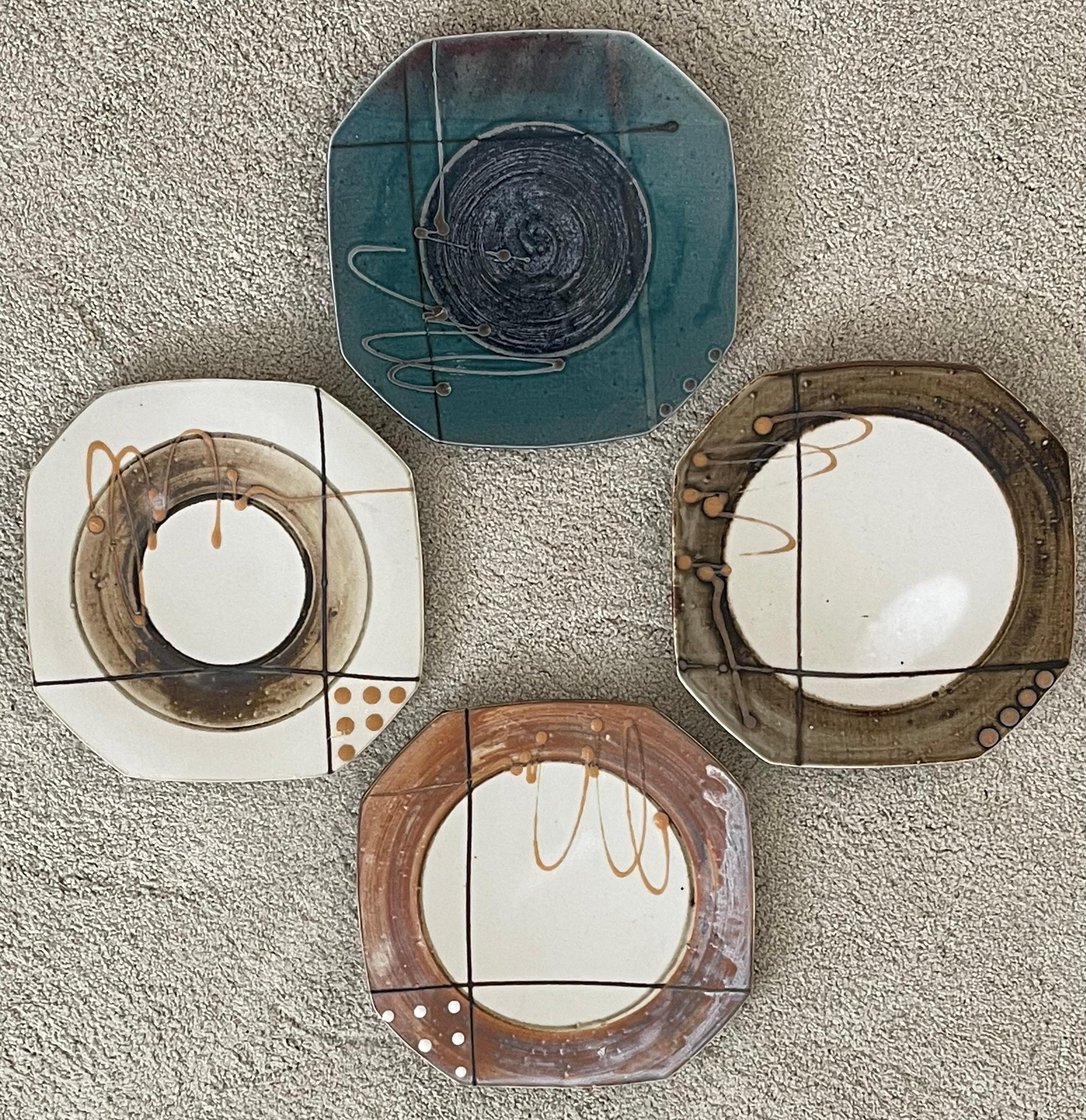 A very cool set of four post-modern stoneware plates by Marshall, circa early 1980s. This plates are in very good vintage condition with no chips or cracks and each plate measures 10.25