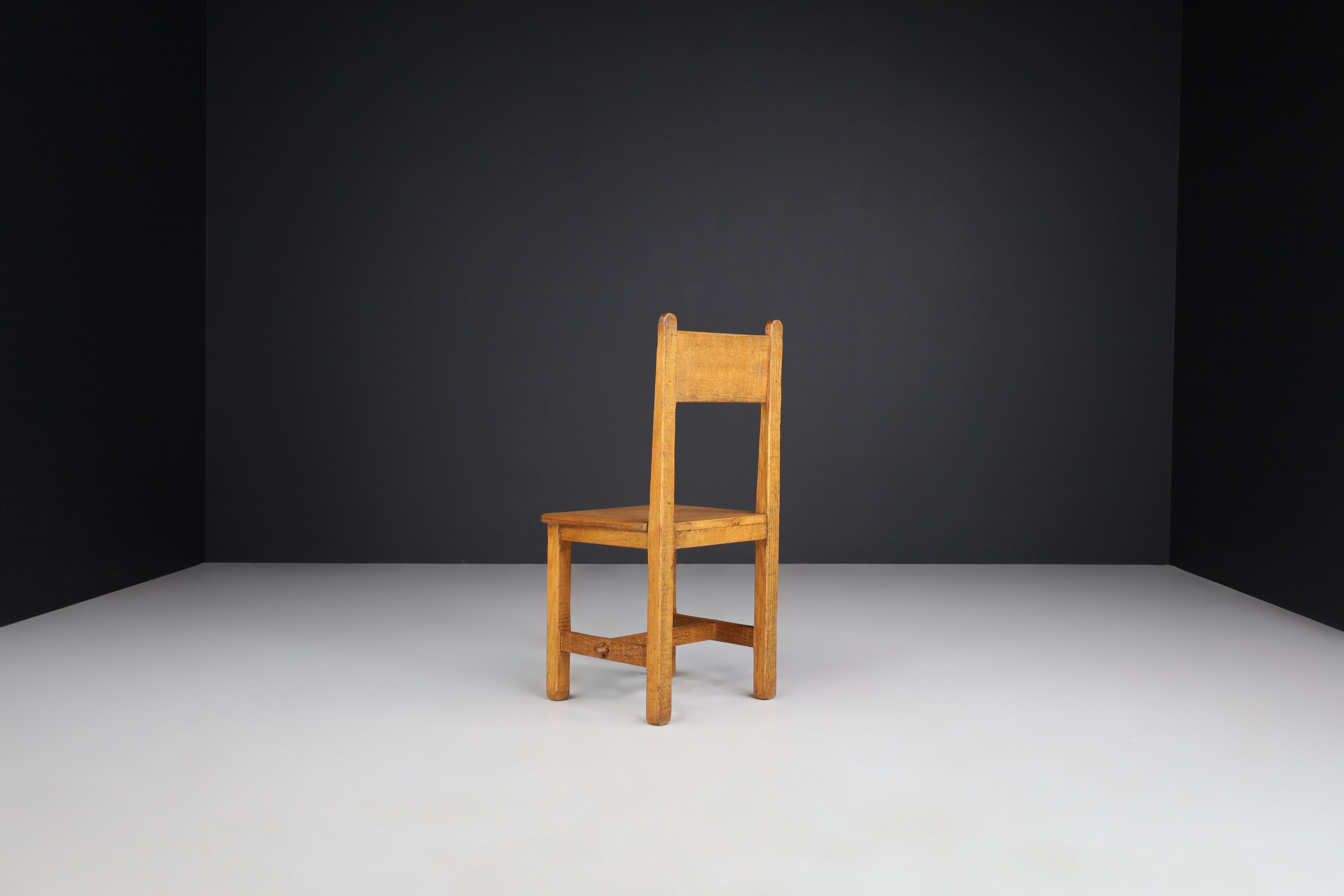 Set of Four Primitive Chairs in Patinated Oak, France, 1950s In Good Condition For Sale In Almelo, NL