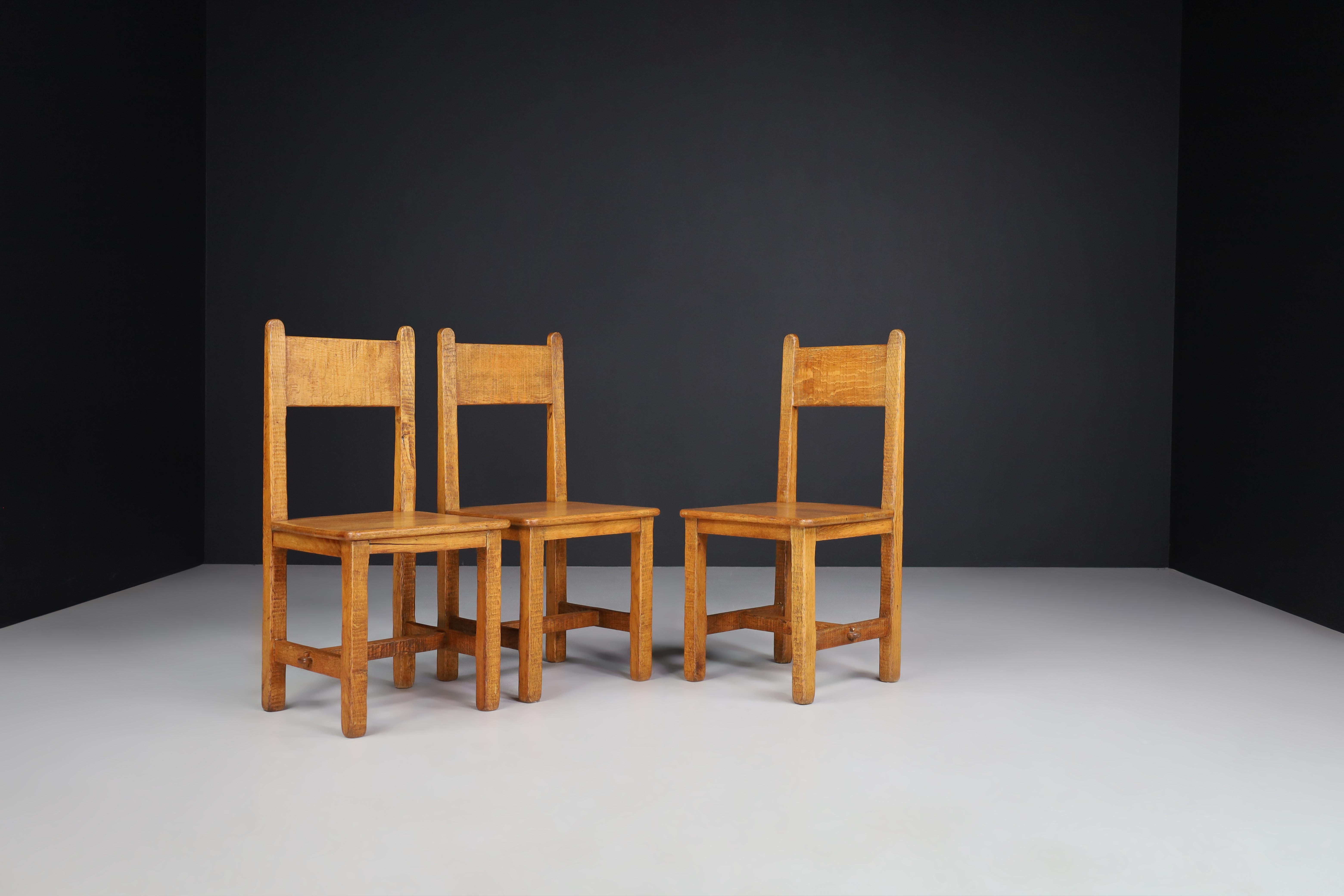 Set of Four Primitive Chairs in Patinated Oak, France, 1950s For Sale 4