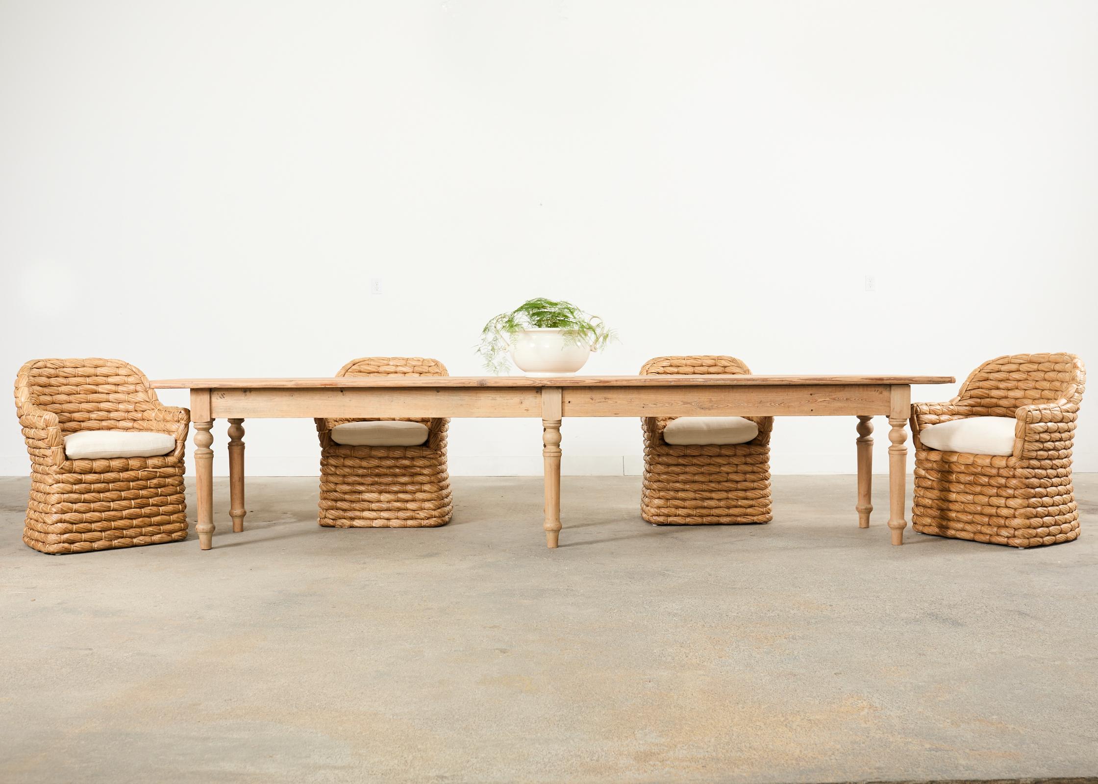 Rare organic modern set of four labeled Ralph Lauren Joshua Tree dining chairs made from abaca hemp woven rope or lampakannay. The iconic chairs features a rattan frame covered with thick woven grass rope. The leaves are dried and braided together