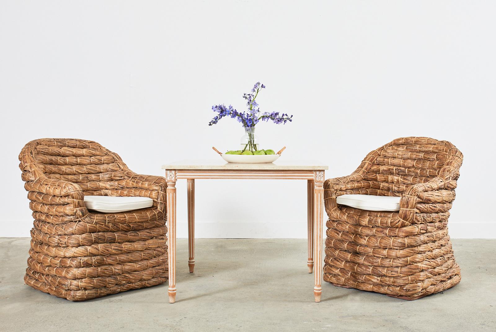 Rare set of four 20th century organic modern dining chairs designed by Ralph Lauren known as Joshua Tree chairs. They feature a rattan frame wrapped with an abaca hemp style rope. The thick braids are crafted from leaves that are woven together to