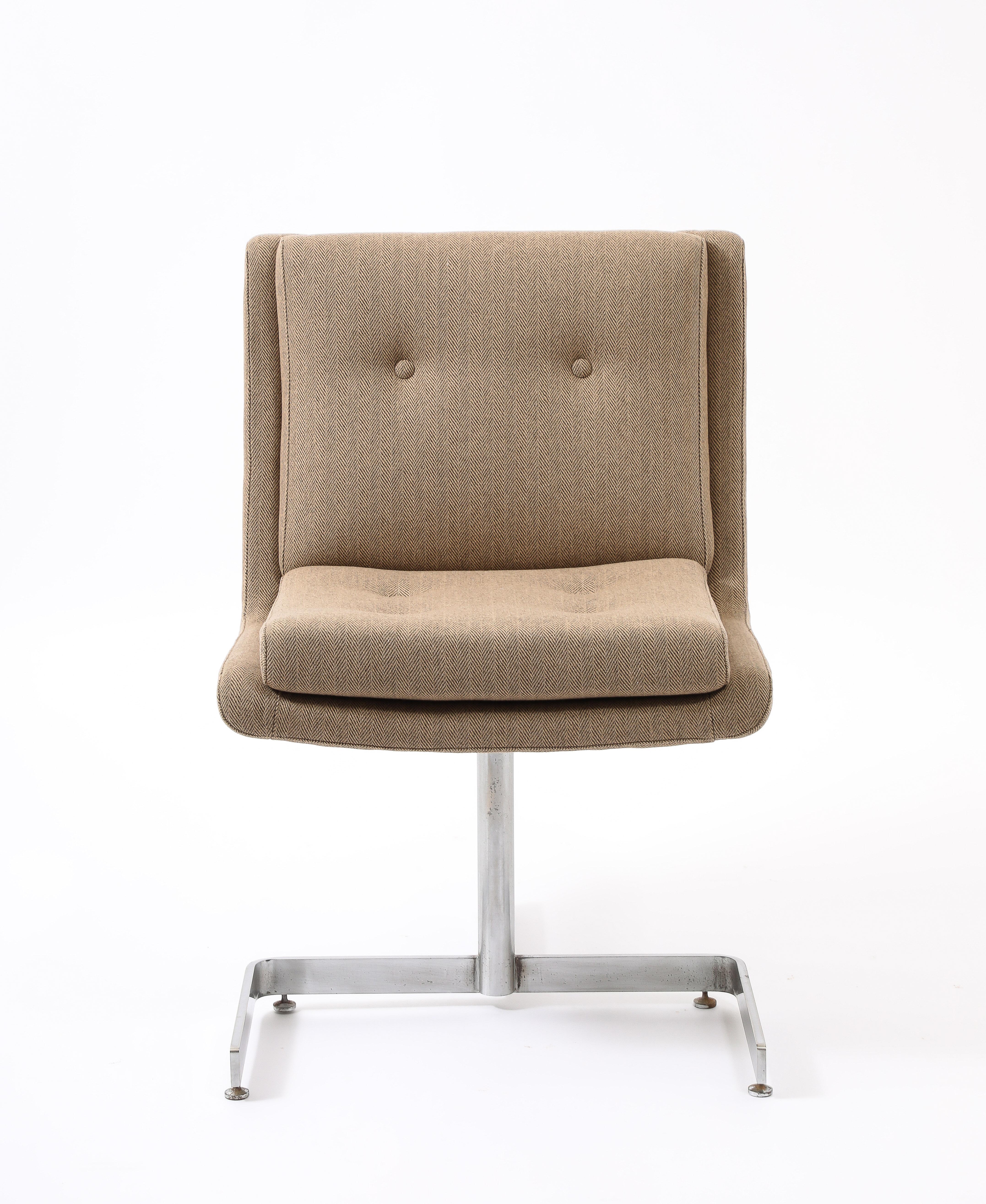 Set of four Raphael dining or side chairs on stainless steel bases.
