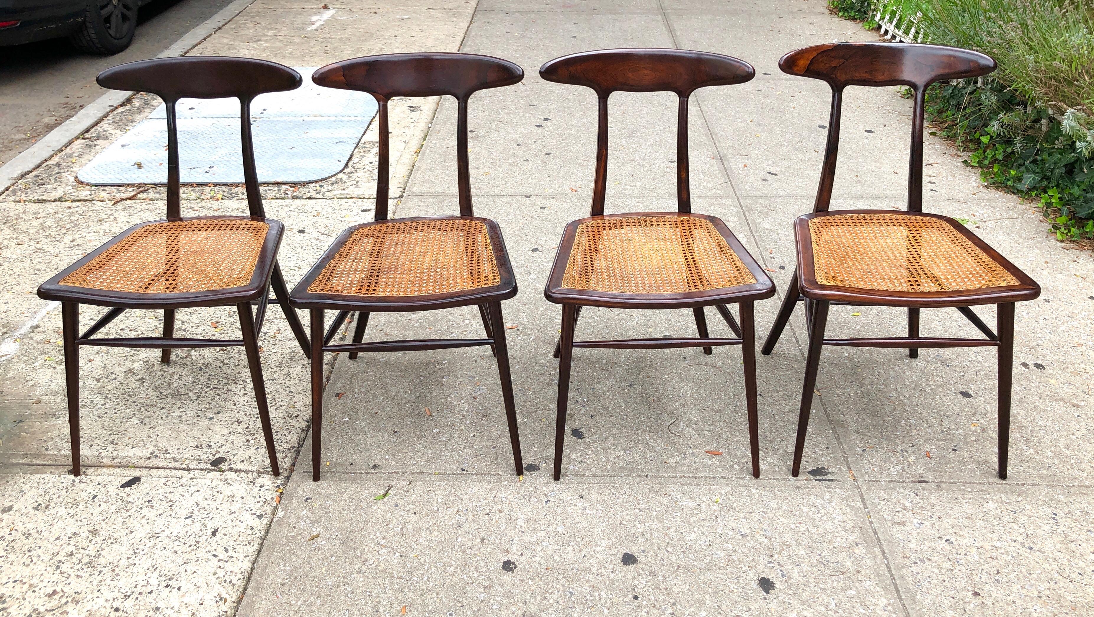 Brazil, circa 1956, delicately carved hardwood frame with hand caned seat. Remnant early Forma Moveis S/A label and Brazilian import stickers to underside.