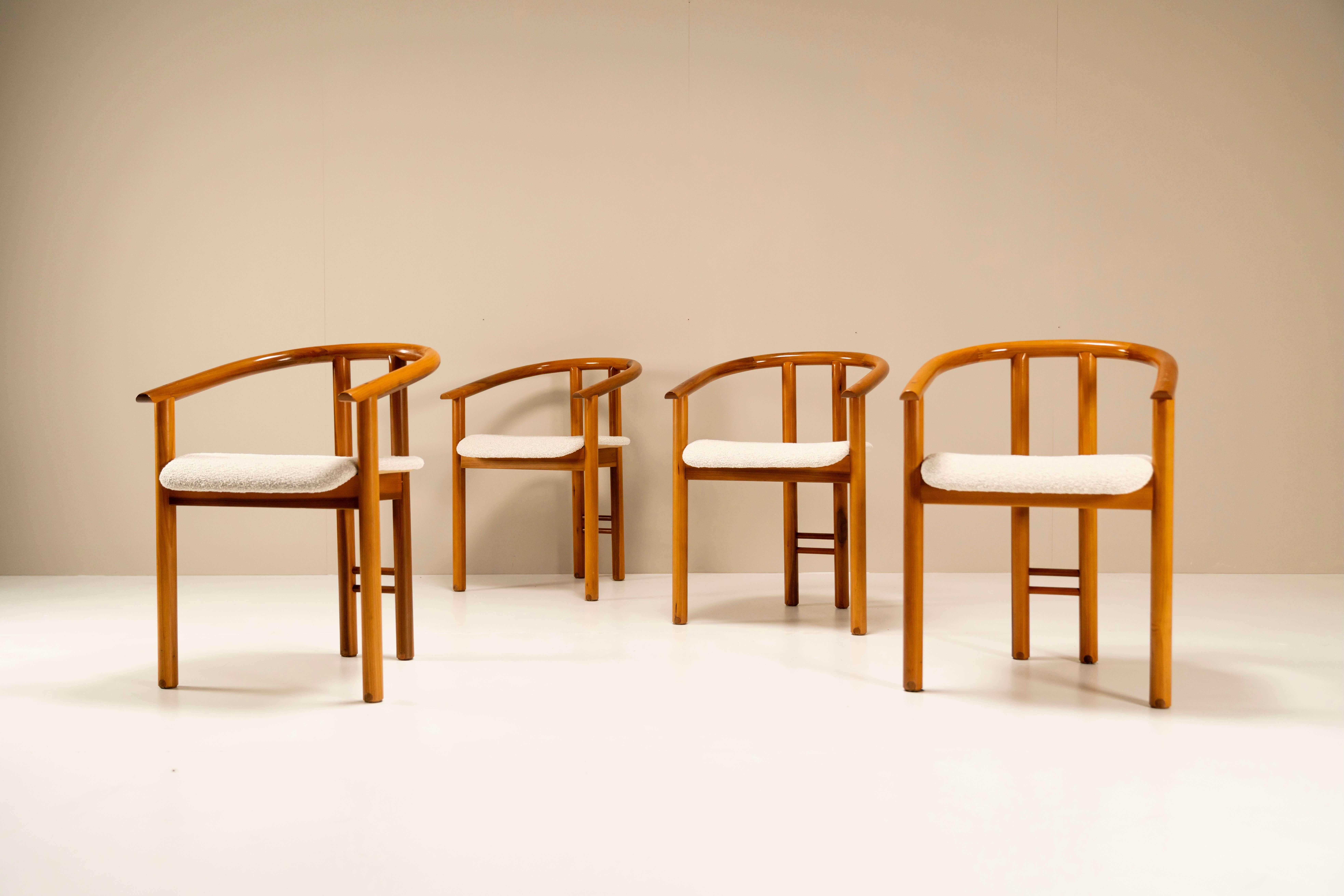 These very refined and rare dining room chairs in walnut wood are manufactured by the Italian Mobil Girgi company in the 1970s. The frame is ingeniously put together and when we look at the chair in detail, we see frequent use of beautiful wood