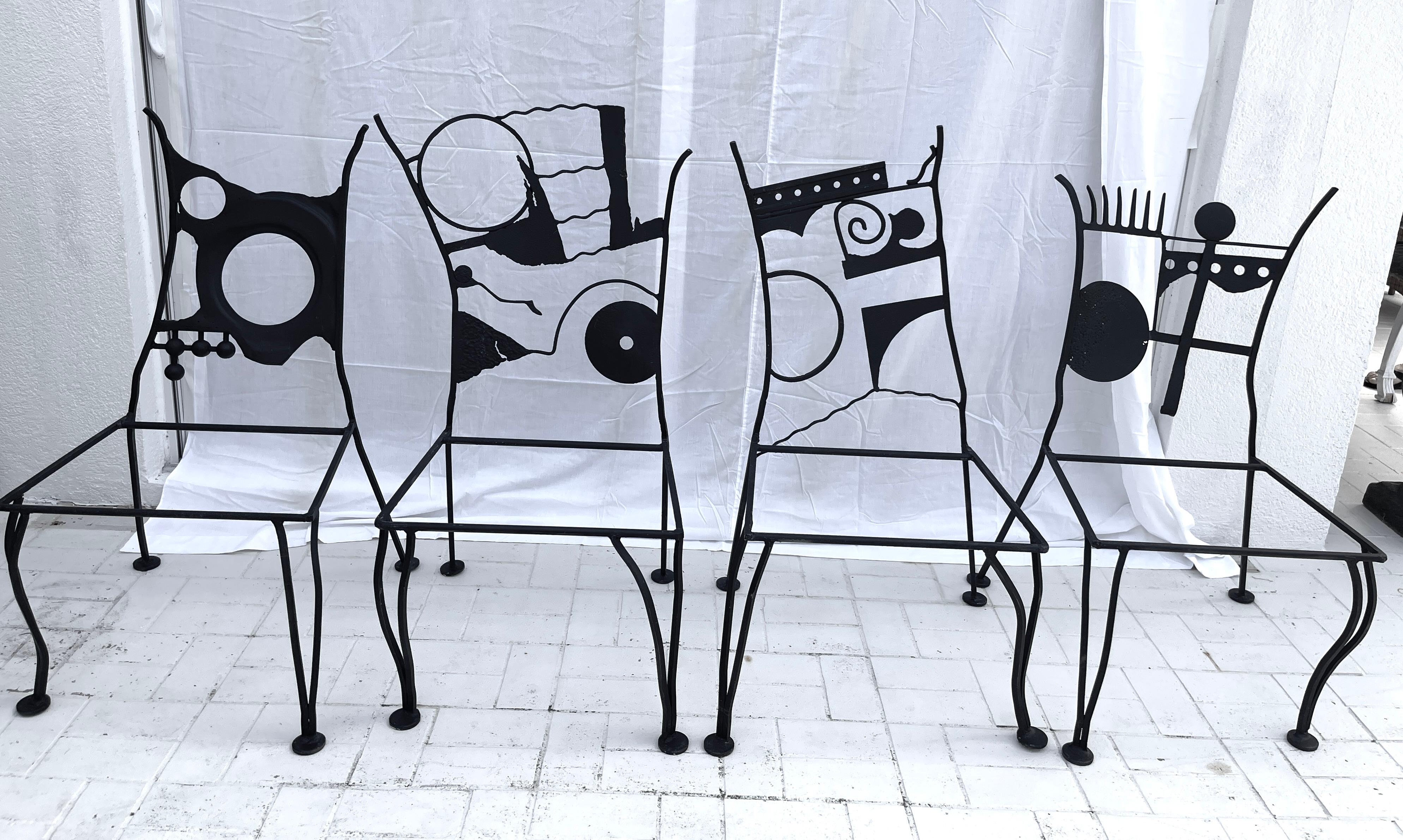 Just in rare set Of Four Pop-Art , Post Modern , Brutalist sandblasted and painted Black  Wrought Iron Chairs.
Each chair has a different design, each unique!
The set has been sand blasted and painted to be used indoors or outdoors.
This set has no