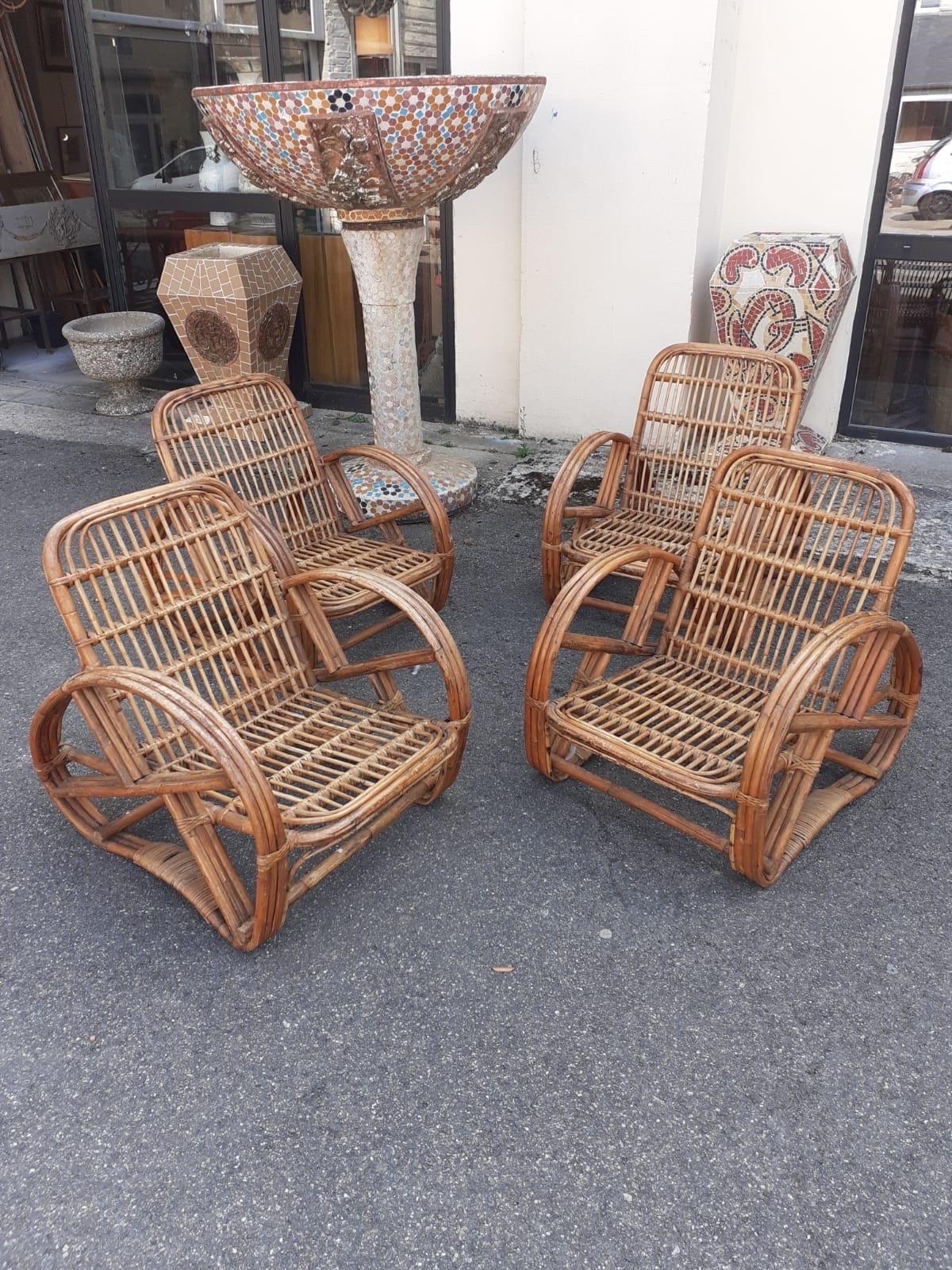 Set of four rattan armchairs For Sale