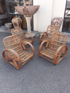 Set of four rattan armchairs