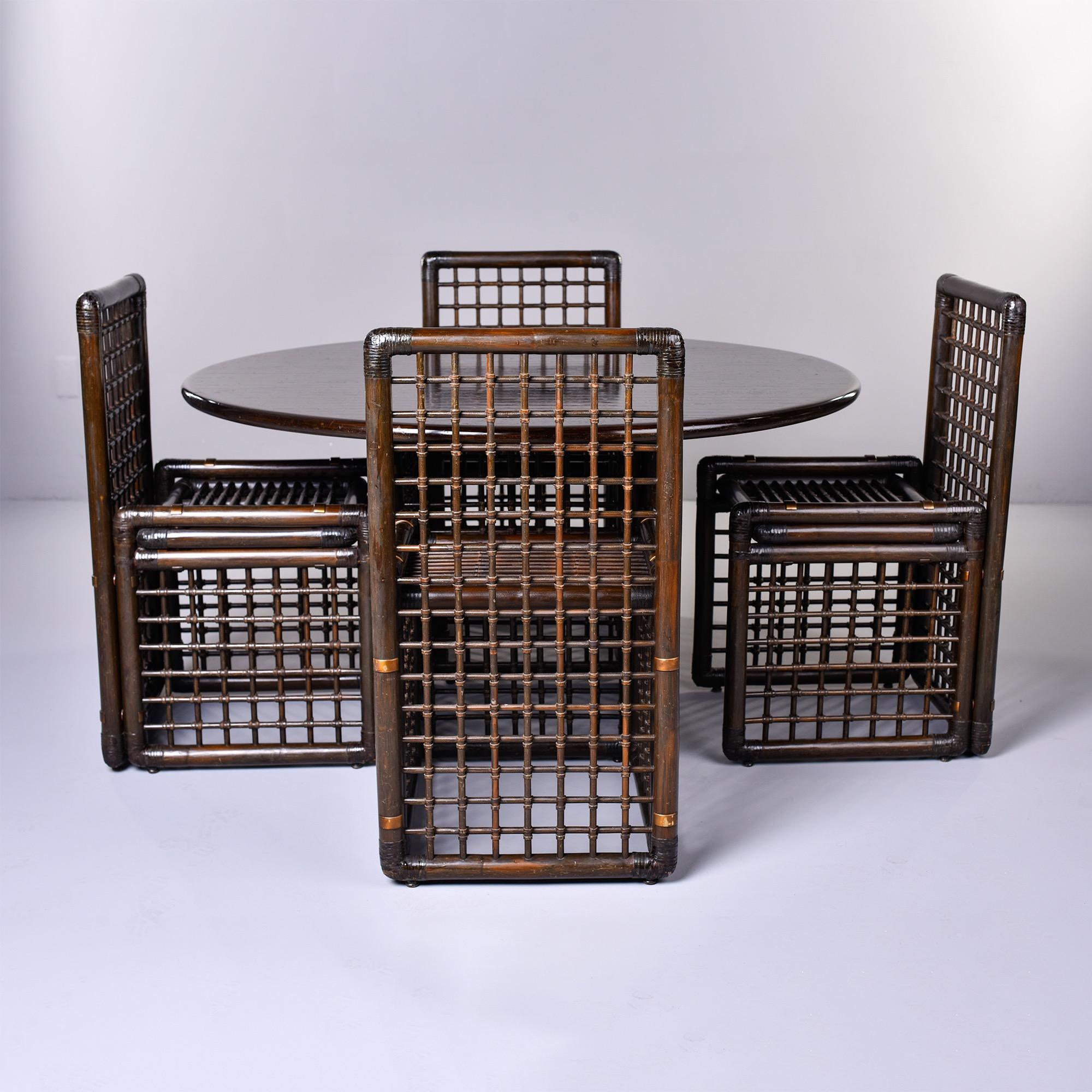 This circa 1970s five piece dining set from the Basilan series consists of four chairs and a round table designed by renowned husband and wife team Tobia and Afra Scarpa for B&B Italia. The chairs are made of rattan and malacca cane. Original