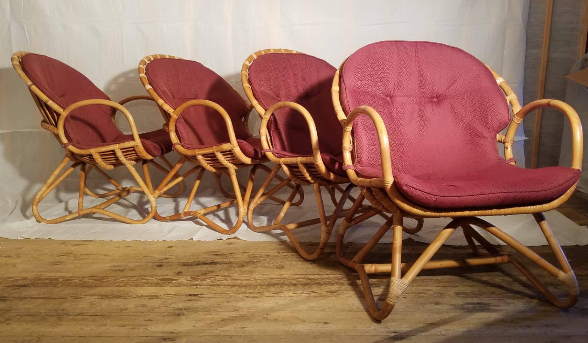 Four rattan lounge chairs and table in the style of Dirk van Sliedregt circa 1960.
