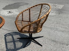 Set of four rattan swivel chairs with a matching table from the 1960´s