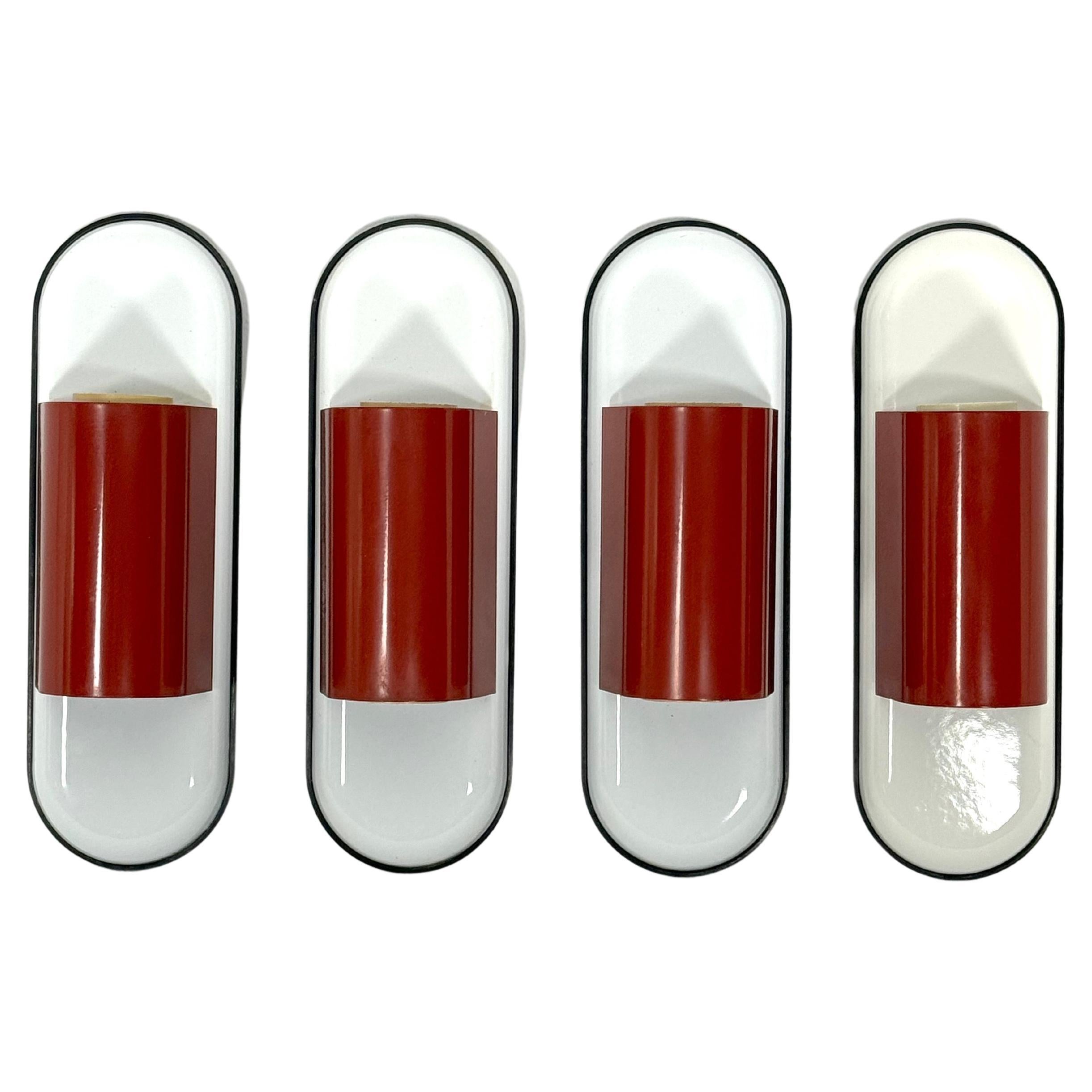 Set of four red Dui sconces by Vico Magistretti for Artemide. Italy 1970s For Sale