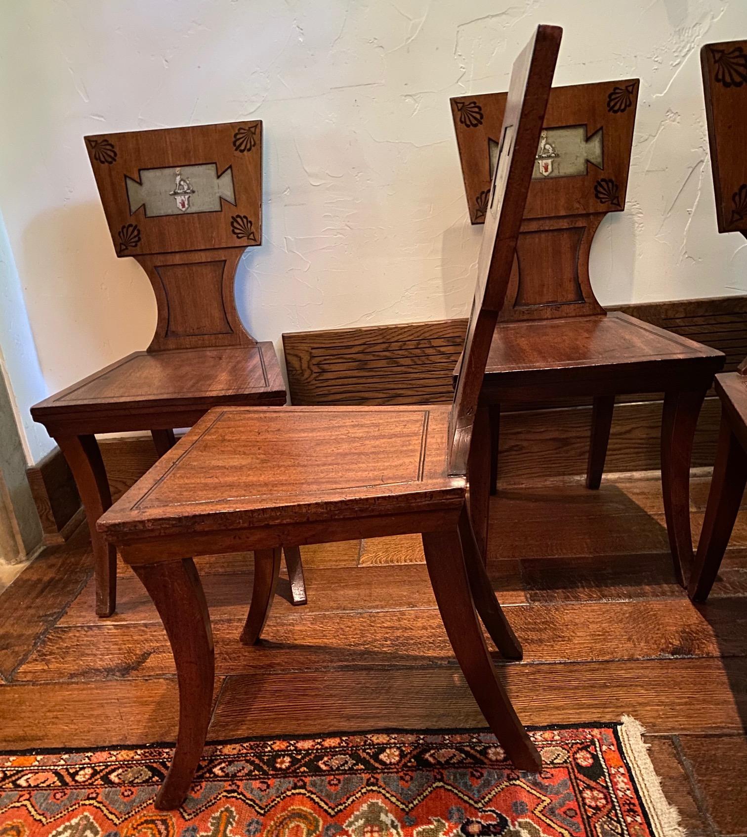Set of Four Regency Mahogany and Ebony Armorial Hall Chairs In Good Condition For Sale In Palm Beach, FL