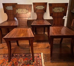 Set of Four Regency Mahogany and Ebony Armorial Hall Chairs
