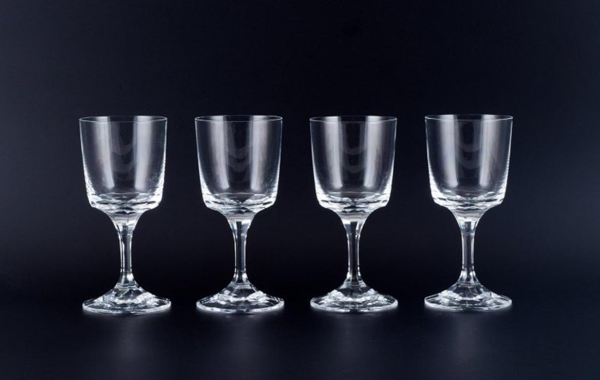 A set of four René Lalique Chenonceaux red wine glasses.
Clear mouth-blown crystal glass with facet-cut stem.
Mid-20th century.
Signed Lalique, France.
In perfect condition.
Dimensions: H 17.6 cm x D 8.0 cm.