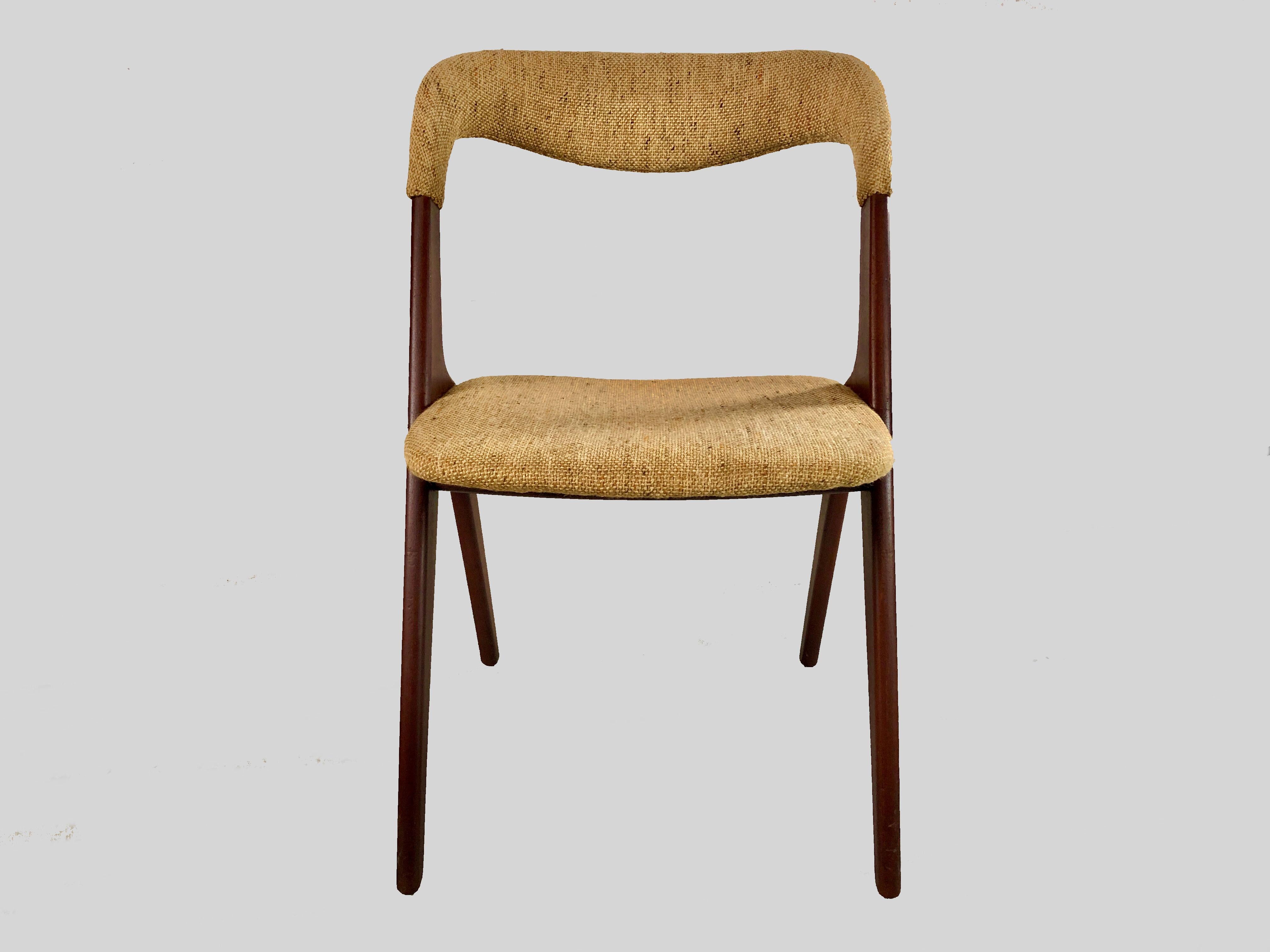 Set of four restored Johannes Andersen dining chairs in teak inc. custom reupholstery designed for Vamo Sønderborg 

The comfortable chairs features a solid minimalistic shaped teak frame with a soft and organic shaped backrest creating a light and