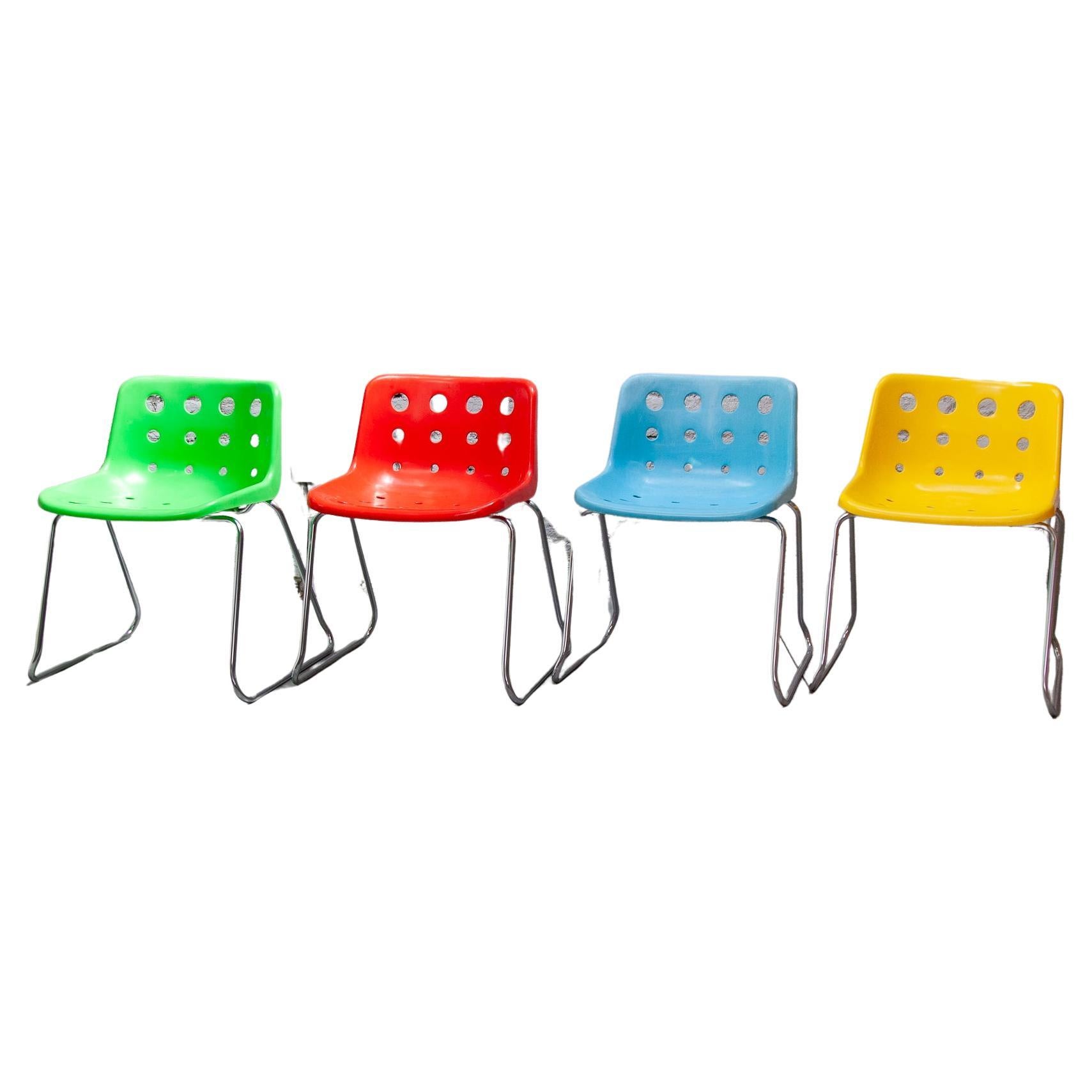 Set of four Robin Day for Loft 'Polo' sled stackable chairs.  The seat is made from polypropylene with a chromed-steel base which can be used both indoor and outdoors.  
This type chair has won many accolades. This set of four original designed in