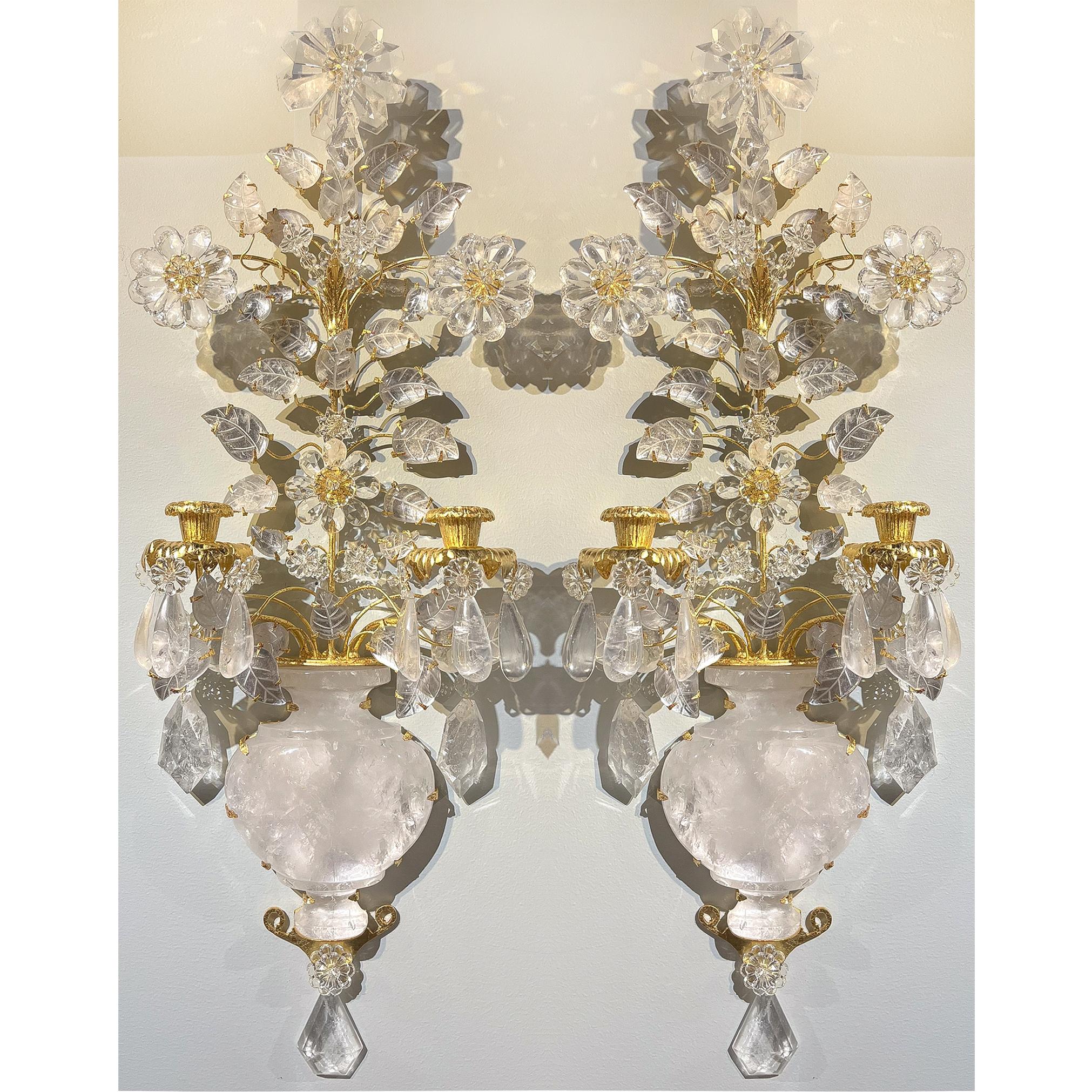 Set of four rock crystal two-light Bouquet Sconces in the form of a bellied vase with flowers. Cut crystal flowers with individual petals, and leaves with delicately carved veining, tear drop cut crystal hanging throughout the entire composition.