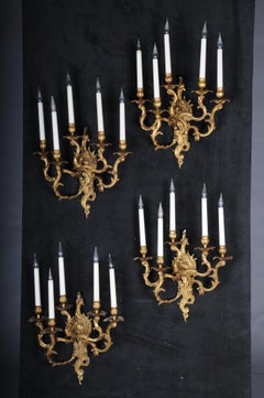 Set of four Rococo bronze sconces, gold, early 20th century.
