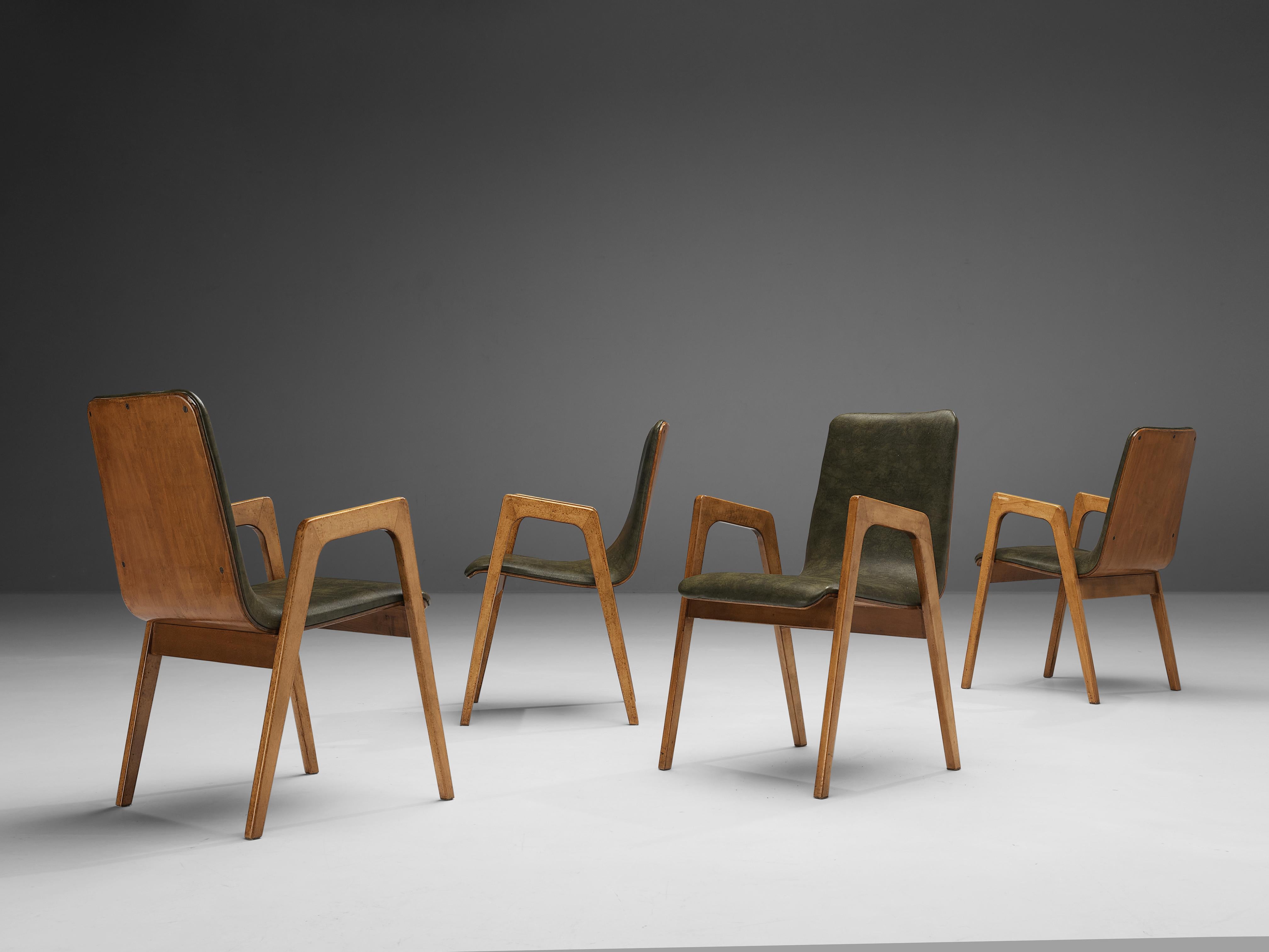 Roland Rainer, set of four armchairs, birch, faux leather, Austria, 1960s.

This set of armchairs, designed by Roland Rainer, was executed to perfection and provide great comfort. These chairs look almost sculpted thanks to the exquisite woodwork