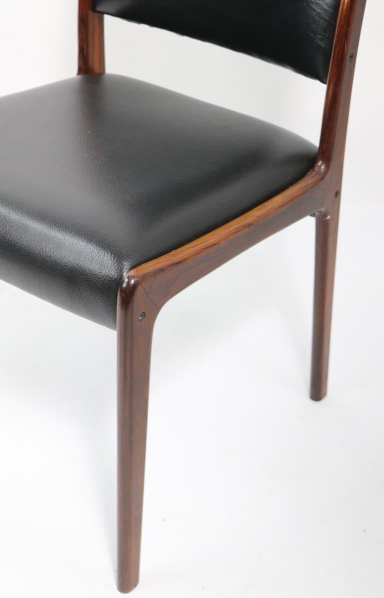 Scandinavian Modern Set of Four Rosewood Dining Chairs by Johannes Andersen for Mogens Kold For Sale