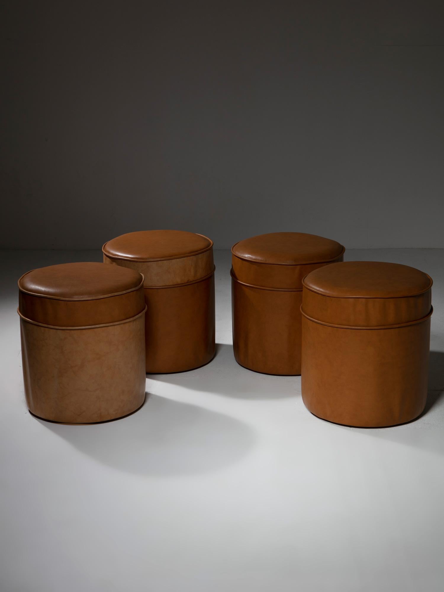 Four Italian 70s leather stools.
