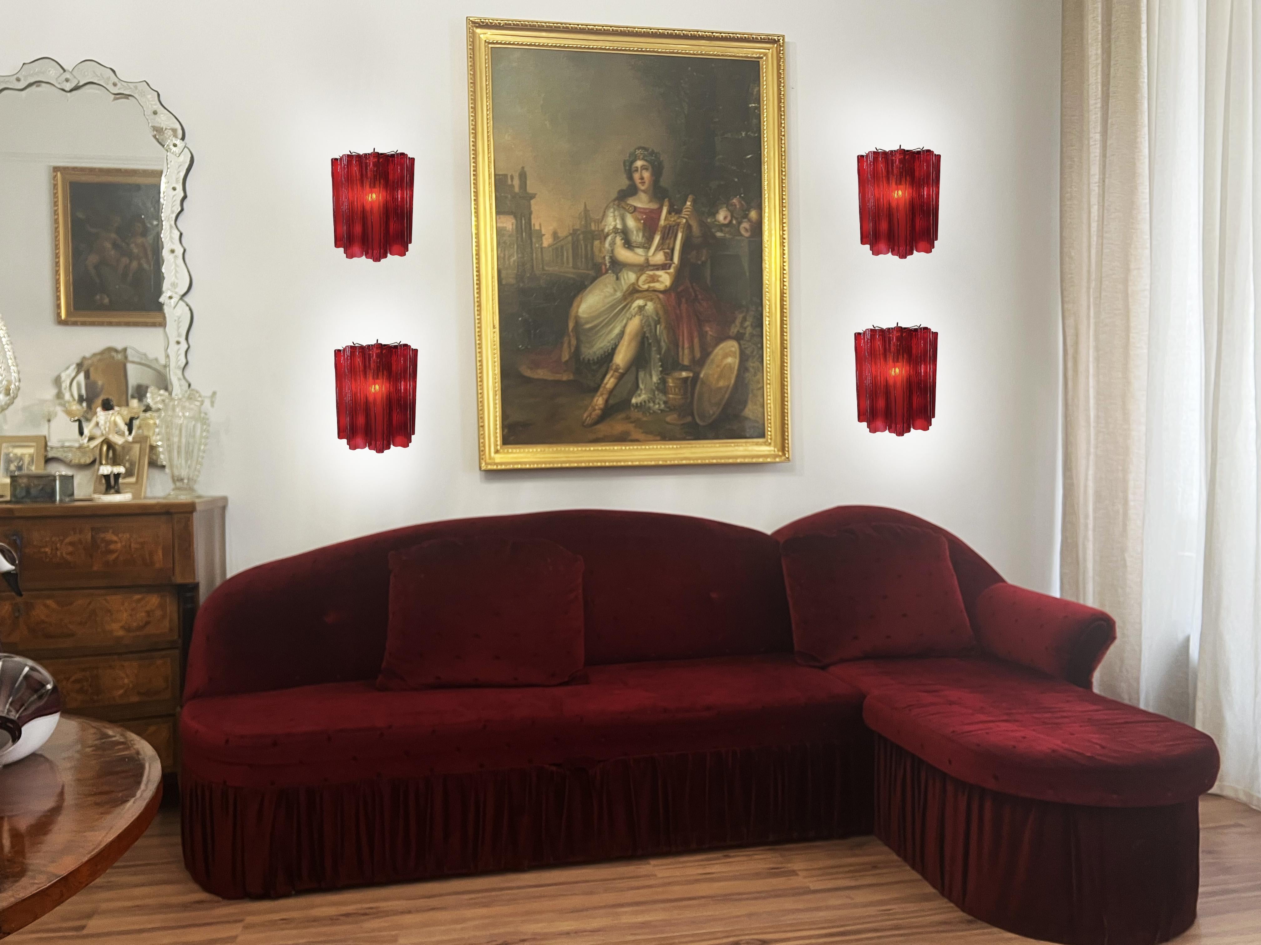 Set of Four wall sconces in Murano glass and nickel-plated metal structure. The armor polished nickel supports 5 large Ruby glass tubes in a star shape for each lamp.
Dimensions: 10,50 inches height (27 cm); 10,50 inches width (27 cm); 5,80 inches