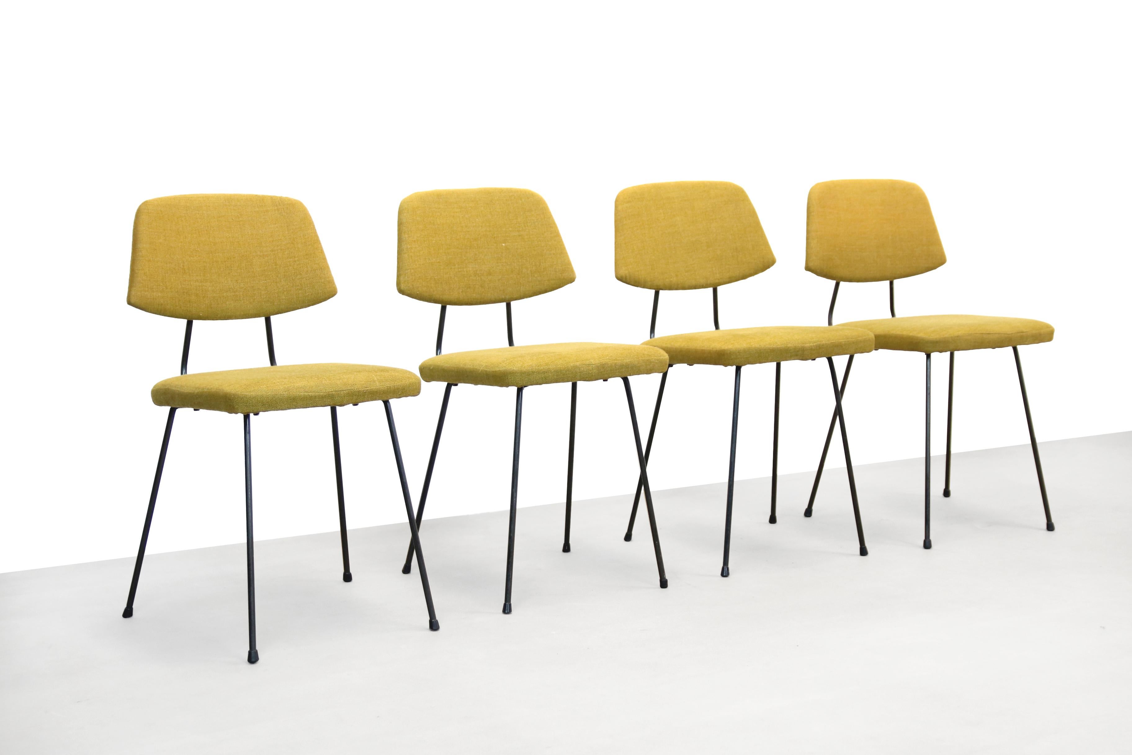 Great set of four dining room chairs by Rudolf Wolf for Elsrijk. The frame is made of black lacquered metal and the chairs are covered with a warm yellow mixed upholstery fabric from Leolux. The total height of the chairs is 79 cm, the seat height