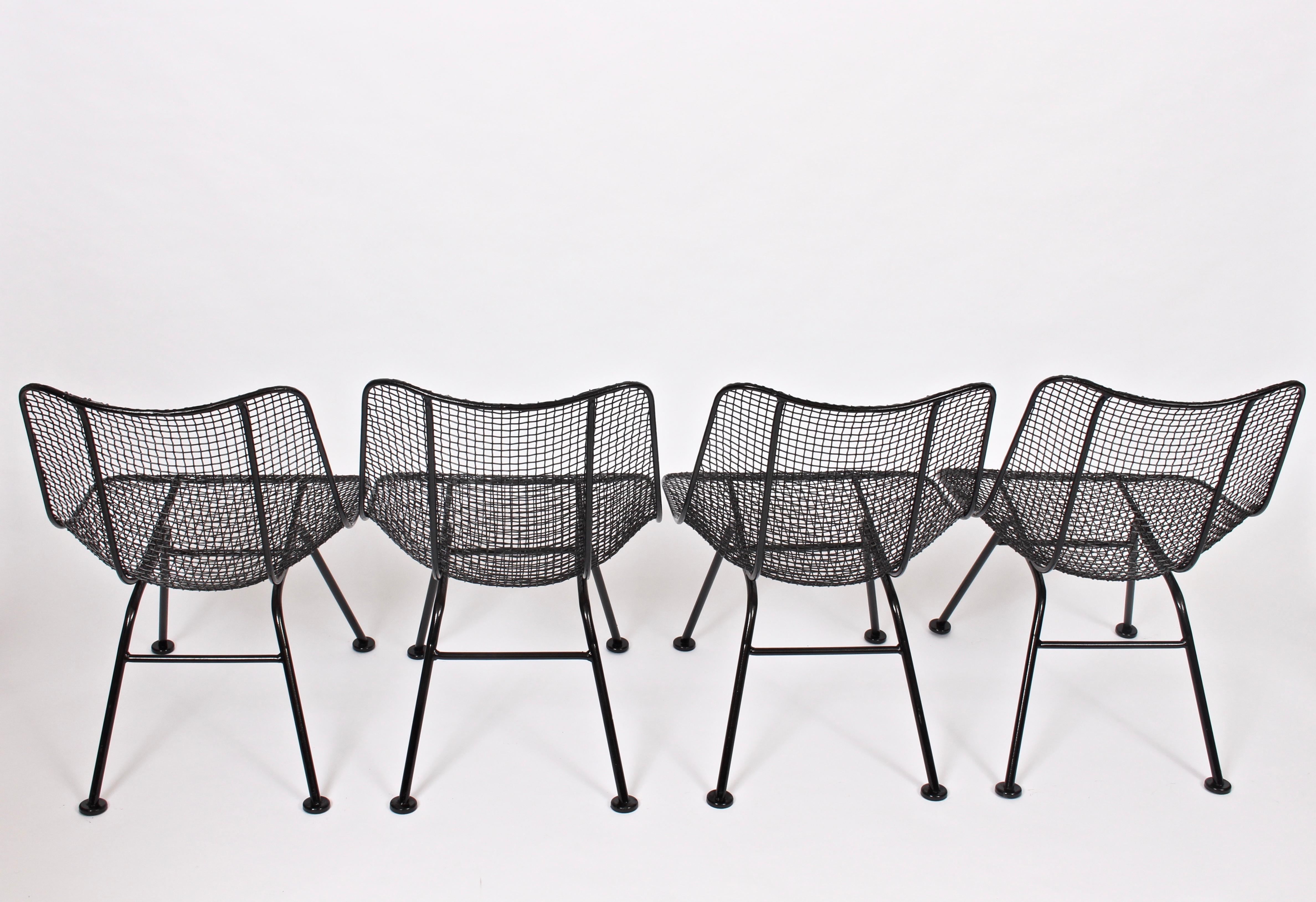 Set of 4 original Russell Woodard handcrafted wire mesh Sculptura lower patio side chairs. Relaxed. Comfortable. Indoor Outdoor seating. Professionally sandblasted and repainted in high gloss Black enamel. Up to 8 chairs available. Priced for set of