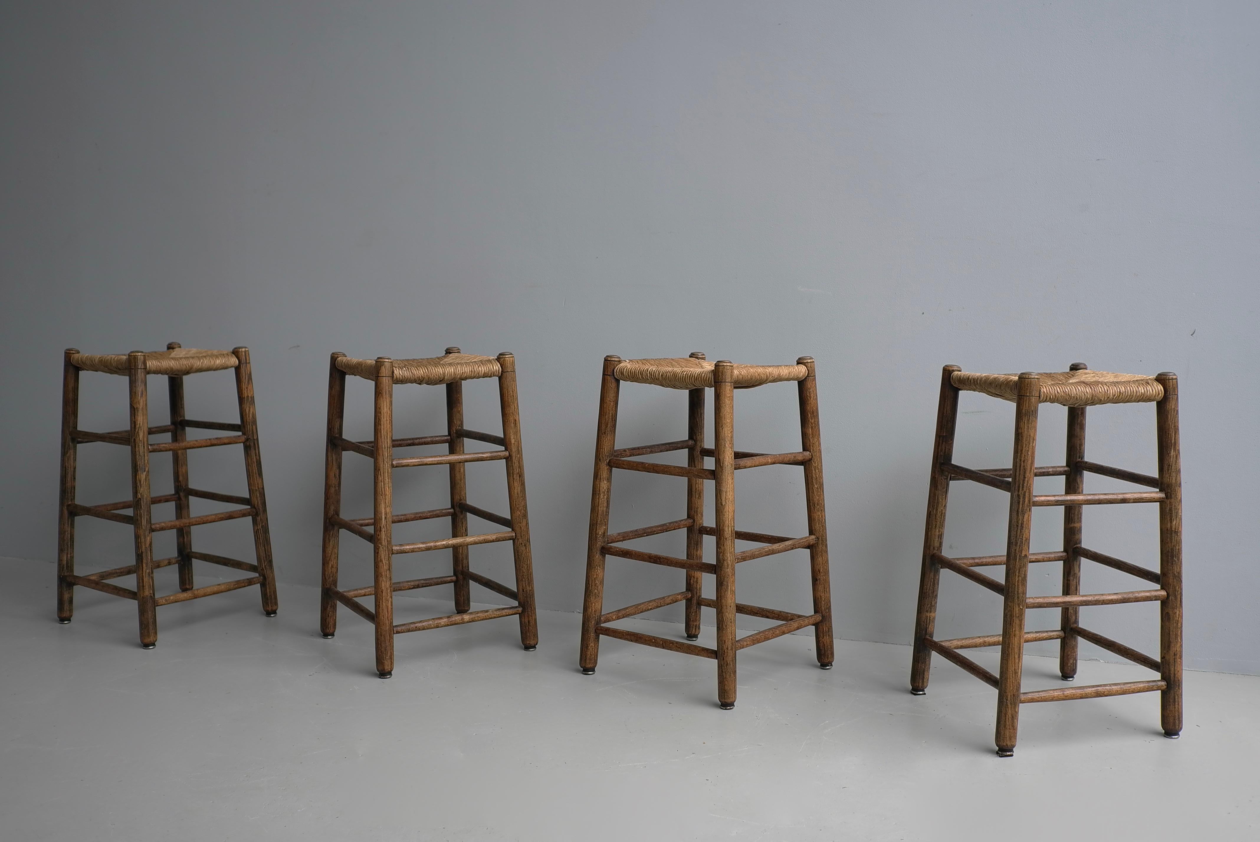 Mid-20th Century Set of Four Rustic French Mid-Century Modern Counter Bar Stools in Solid Oak For Sale