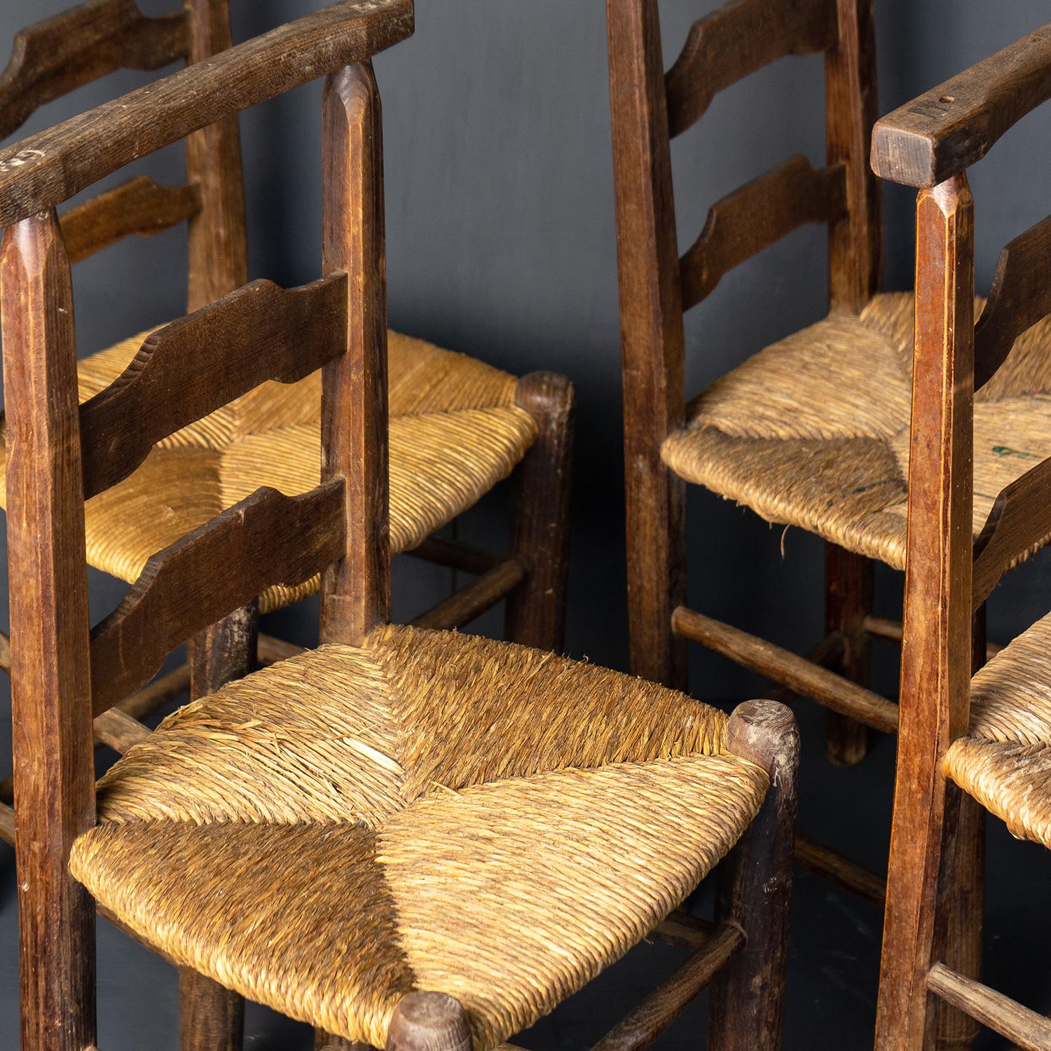 Antique Farmhouse Dining Chairs

Originally from a French country chapel.

Each one tells its own story with different carved initials and remnants of old enamel plaques.

Simple elegant lines with woven rush seats.

They are in very good vintage