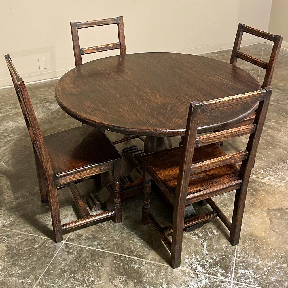 Set of Four Rustic Mid-Century Country French Chairs work great as breakfast room chairs, around a game table, or just for occasional use throughout a casual decor.  Hand-made from solid oak, each features solid plank seats which were designed for